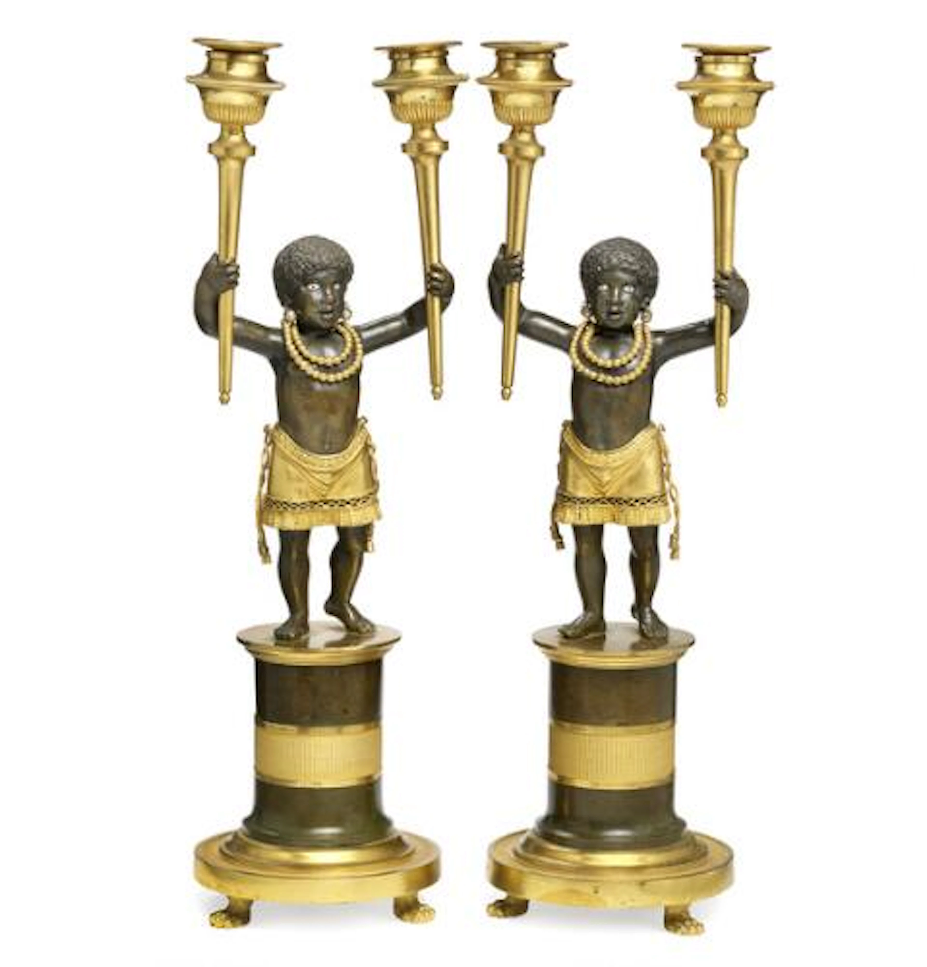 A pair of Directoire gilt and patinated bronze candelabra
