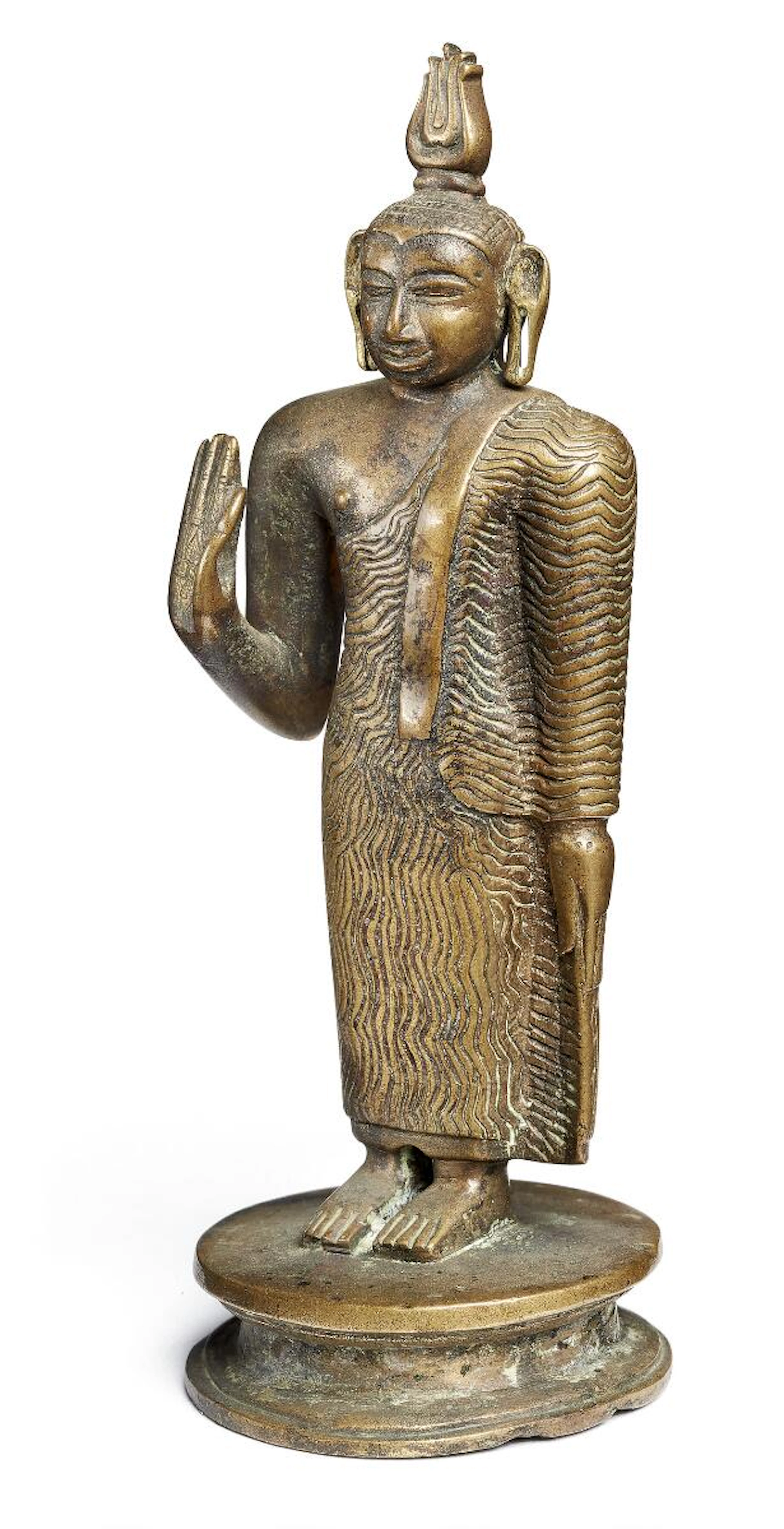 A Sri Lankan copper alloy figure of a standing Buddha