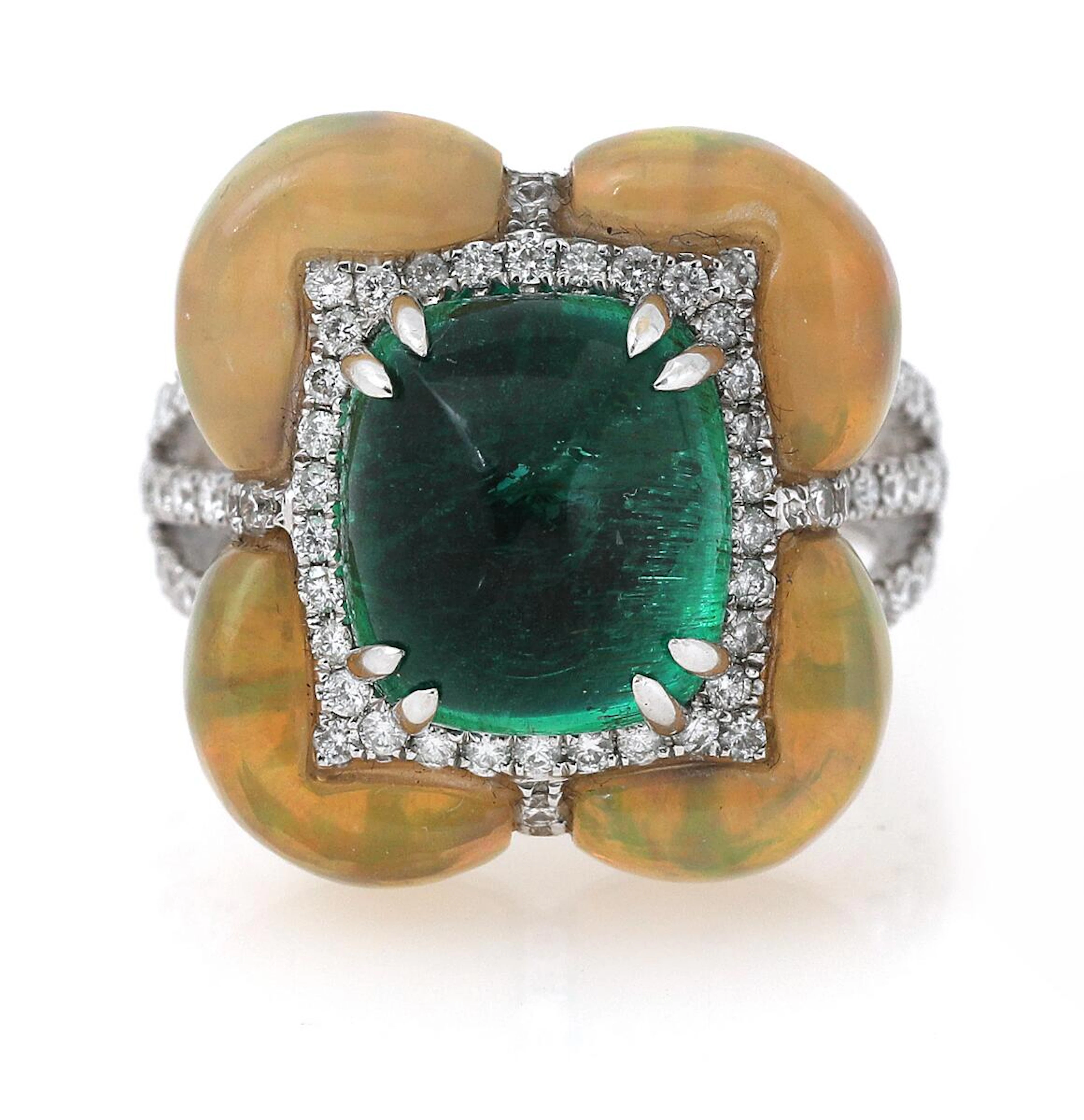 An emerald- and opalring set with a cabochon emerald weighing app
