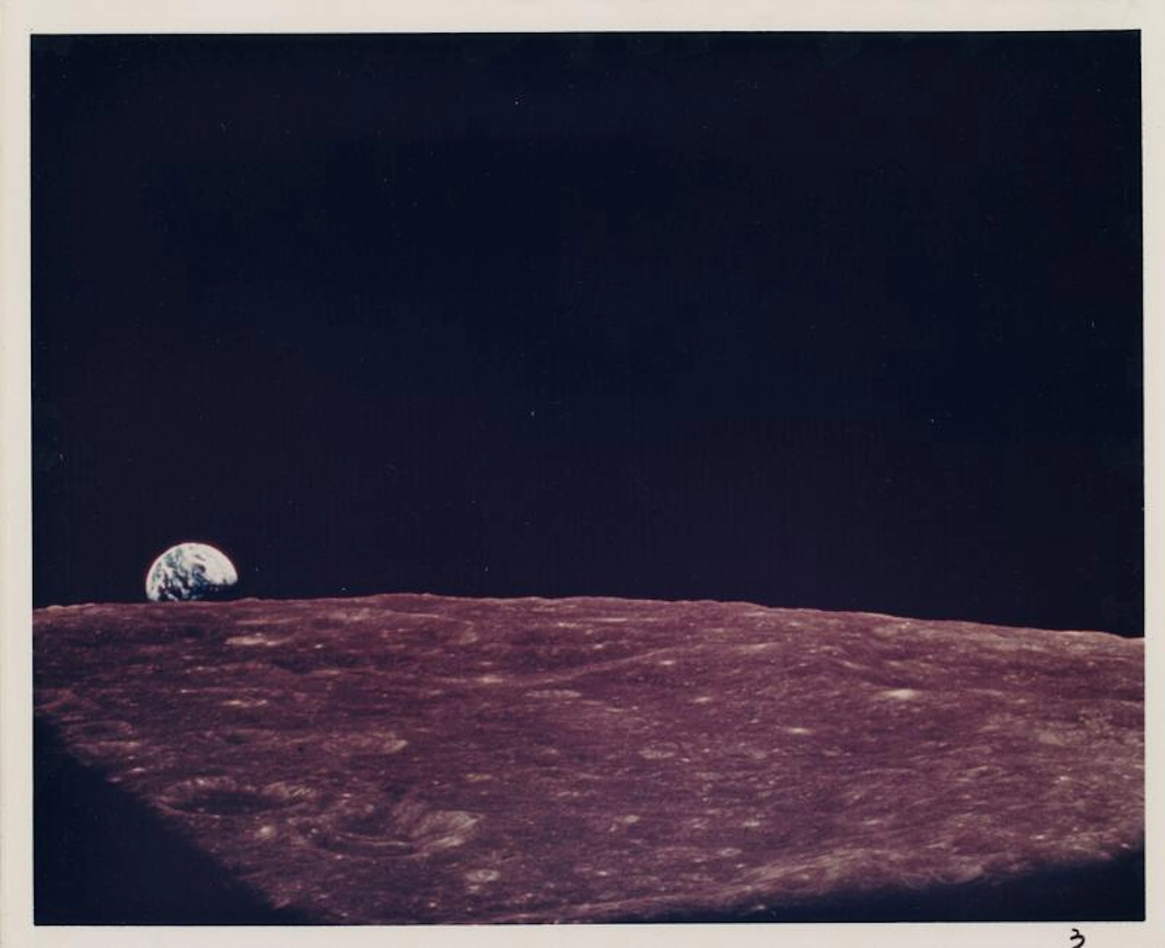 [Apollo 8] Earthrise: the majestic Earth just emerging...
