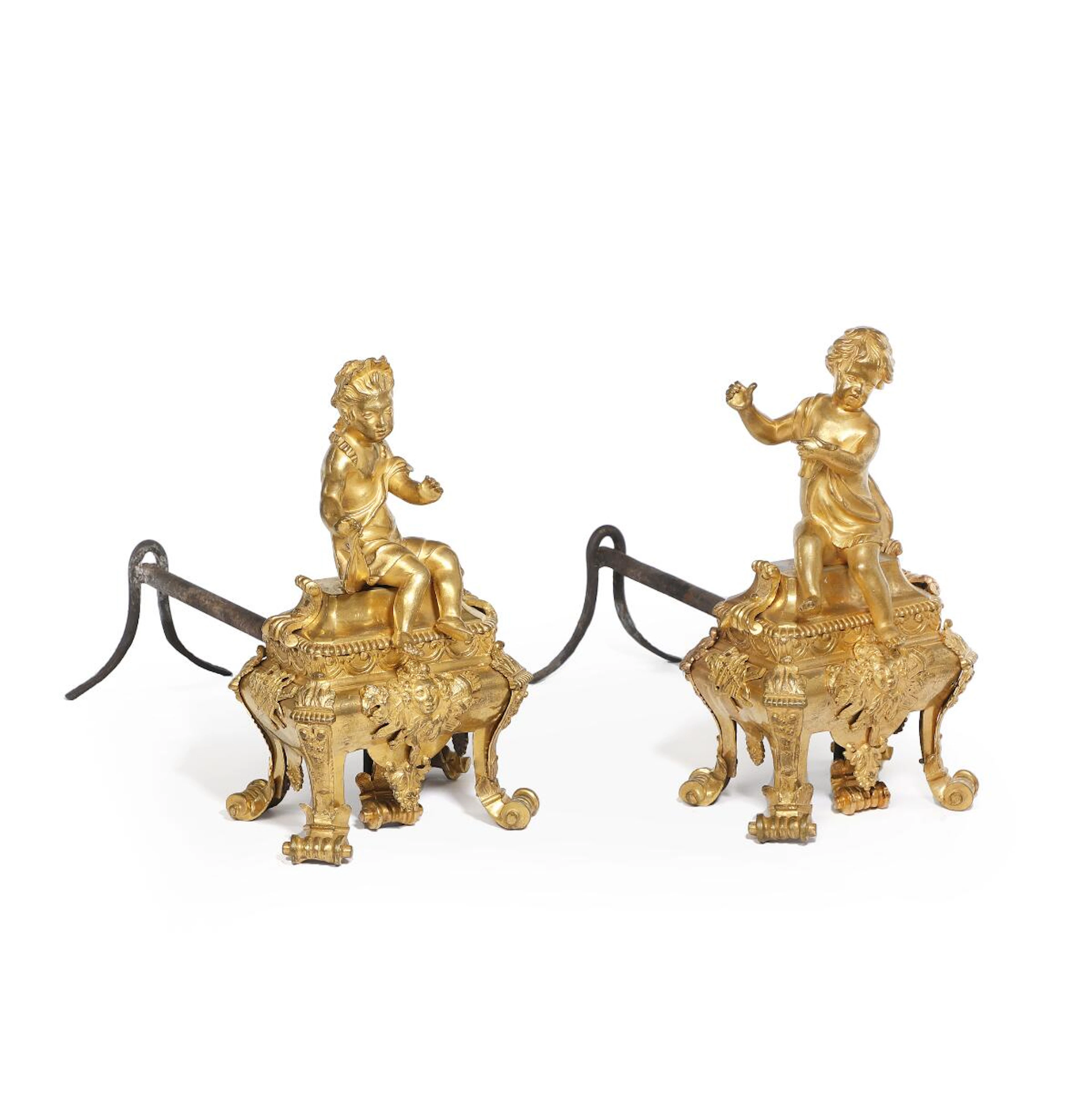 A pair of French Régence gilt-bronze andirons