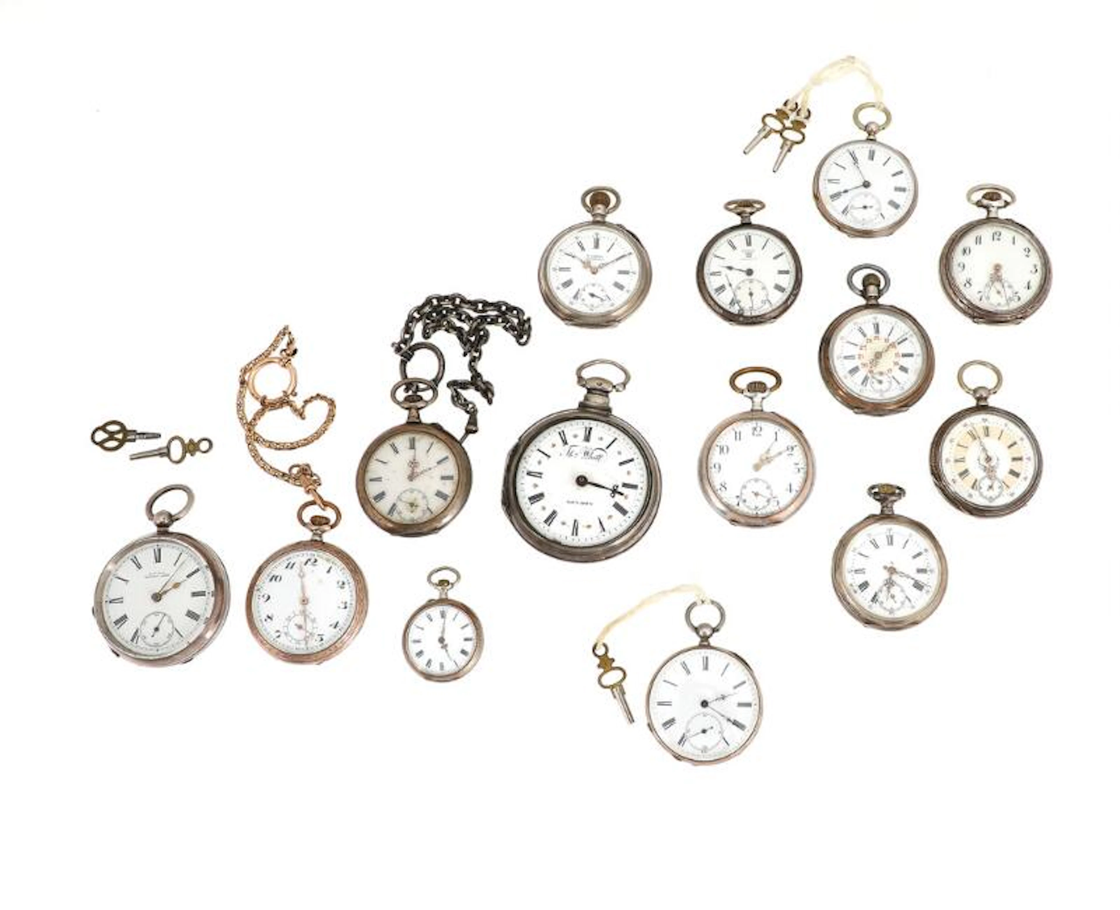 A collection of silver open-face pocket watches