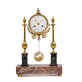 A French table clock of gilt bronze and marble