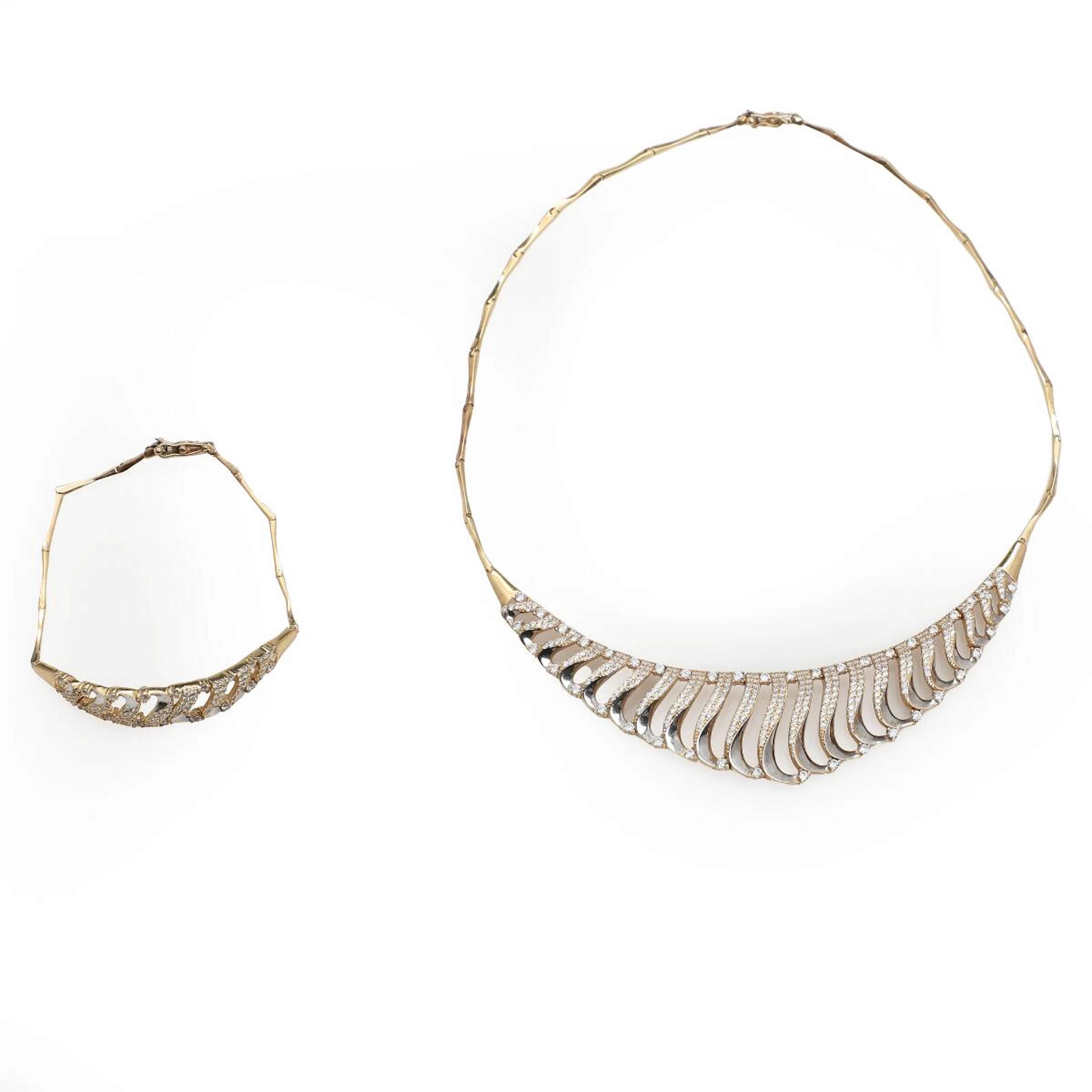 A diamond necklace and bracelet set with numerous brilliant-cut diamonds