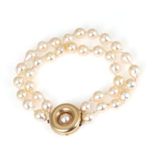 Ole Lynggaard: Two pearl bracelets each set with numerous pearls and