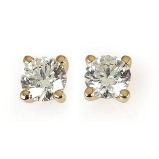 A pair of solitaire diamond ear studs each set with a brilliant-cut