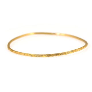 A bangle of 21k gold. Weight app. 11 g. Measurement: 5.5 x 6.5 cm.