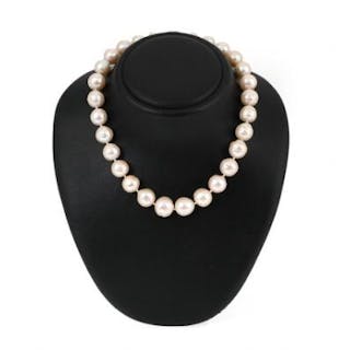 A pearl necklace set with numerous baroque fresh water pearls and