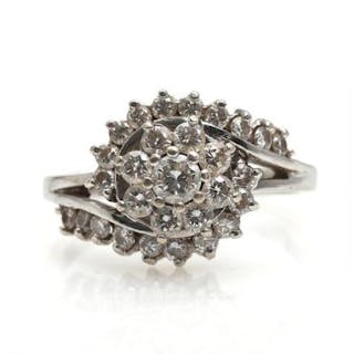 A diamond ring set with numerous brilliant-cut diamonds, mounted in