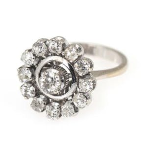 A diamond ring set with numerous old-cut diamonds weighing a total