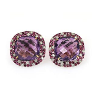 A pair of amethyst, ruby and diamond ear studs each set with an amethyst