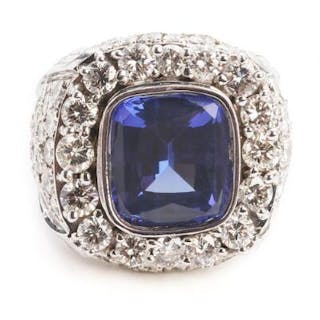 A tanzanite and diamond ring set with a tanzanite weighing app. 13.00