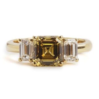 A diamond ring set with a Fancy Deep Brownish Yellow diamond weighing