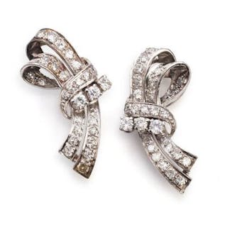A pair of Art Deco diamond ear studs each set with numerous diamonds