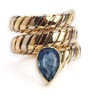 A topaz ring in the shape of a snake set with a pear-shaped topaz