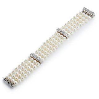 V. Holmstrup: A four-strand pearl and diamond bracelet set with numerous