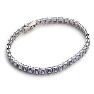 A sapphire bracelet set with numerous sapphires weighing a total of
