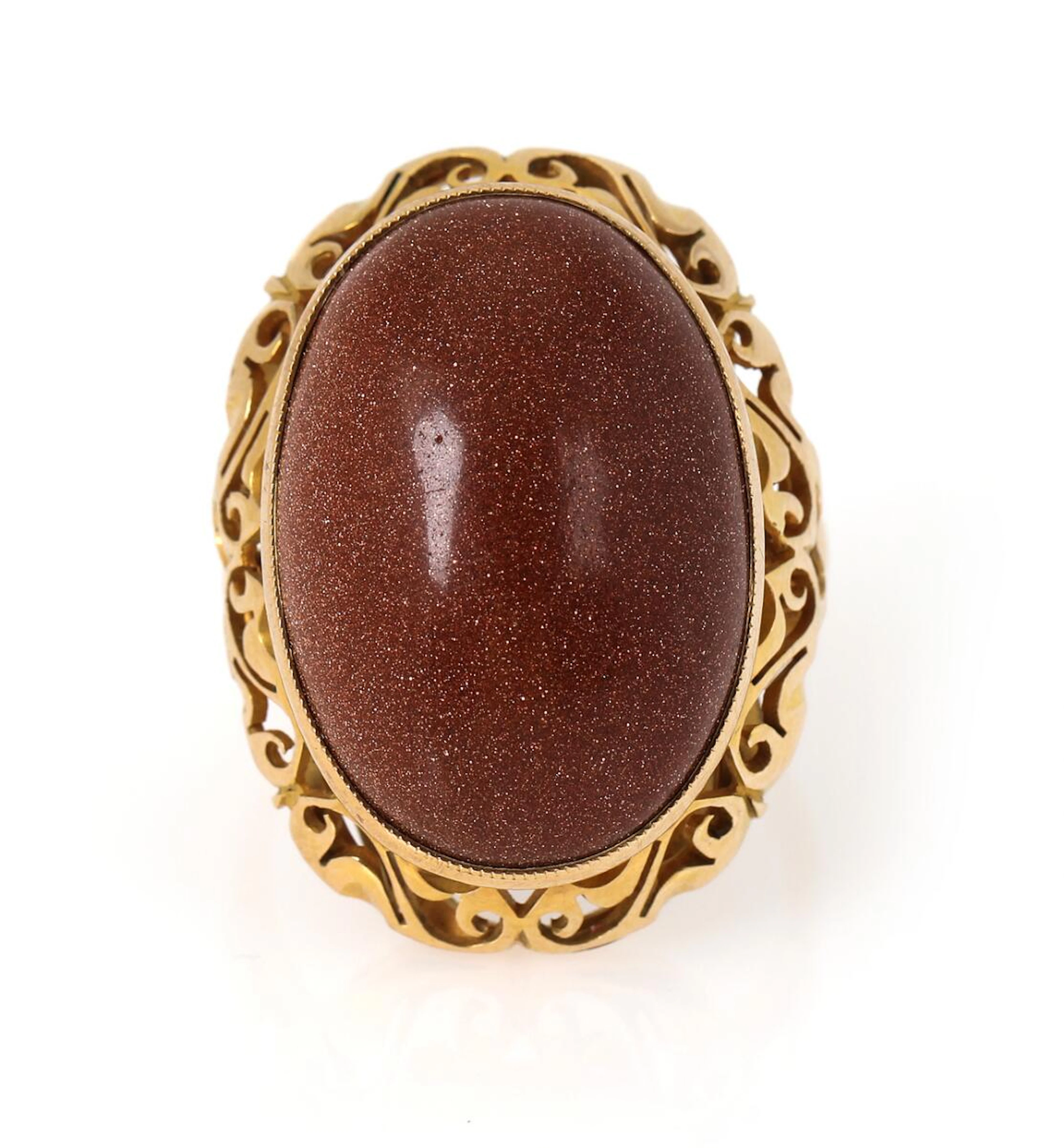 A sunstone ring set with a cabochon sunstone