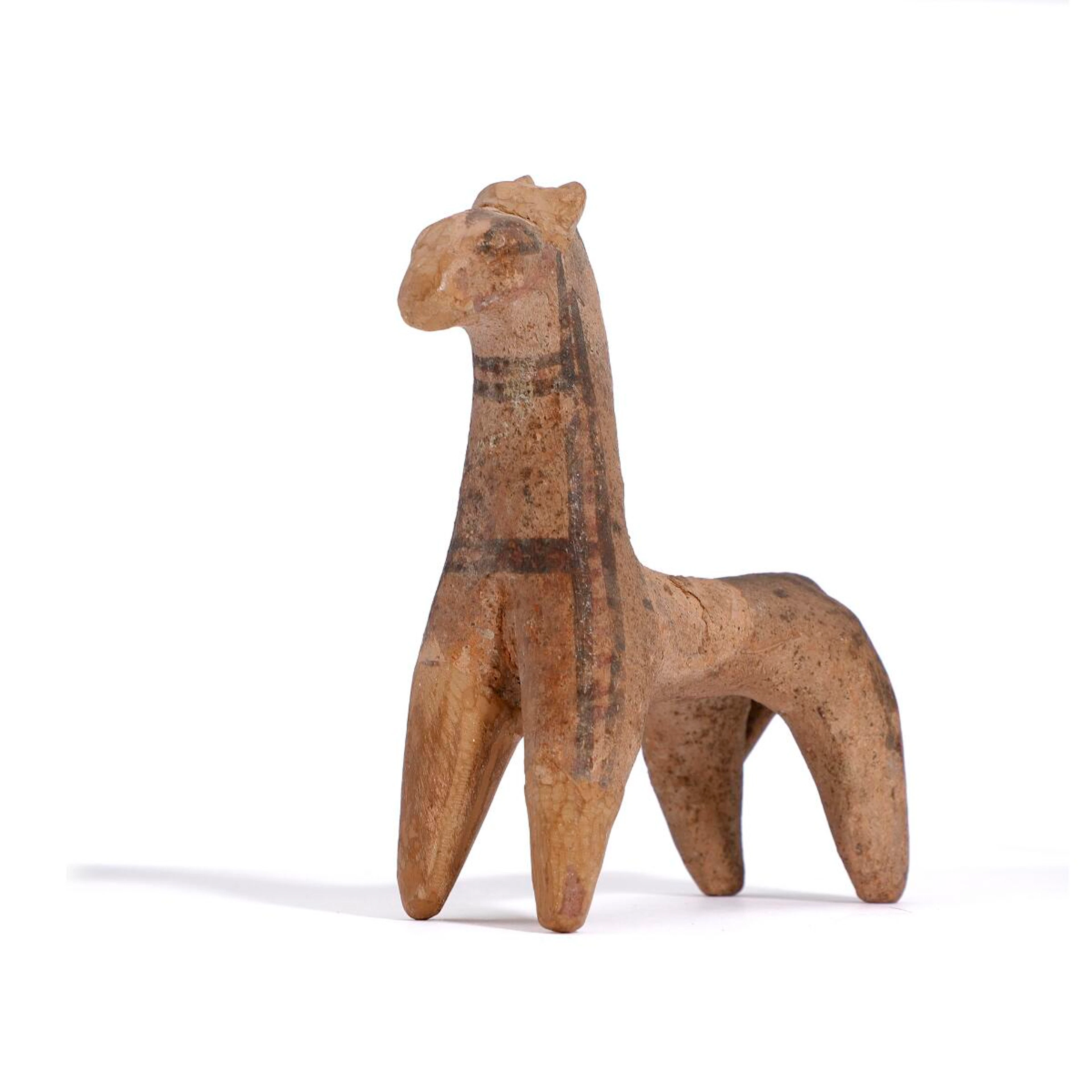 A Cypriot terracotta horse with brown decorated eyes and lines