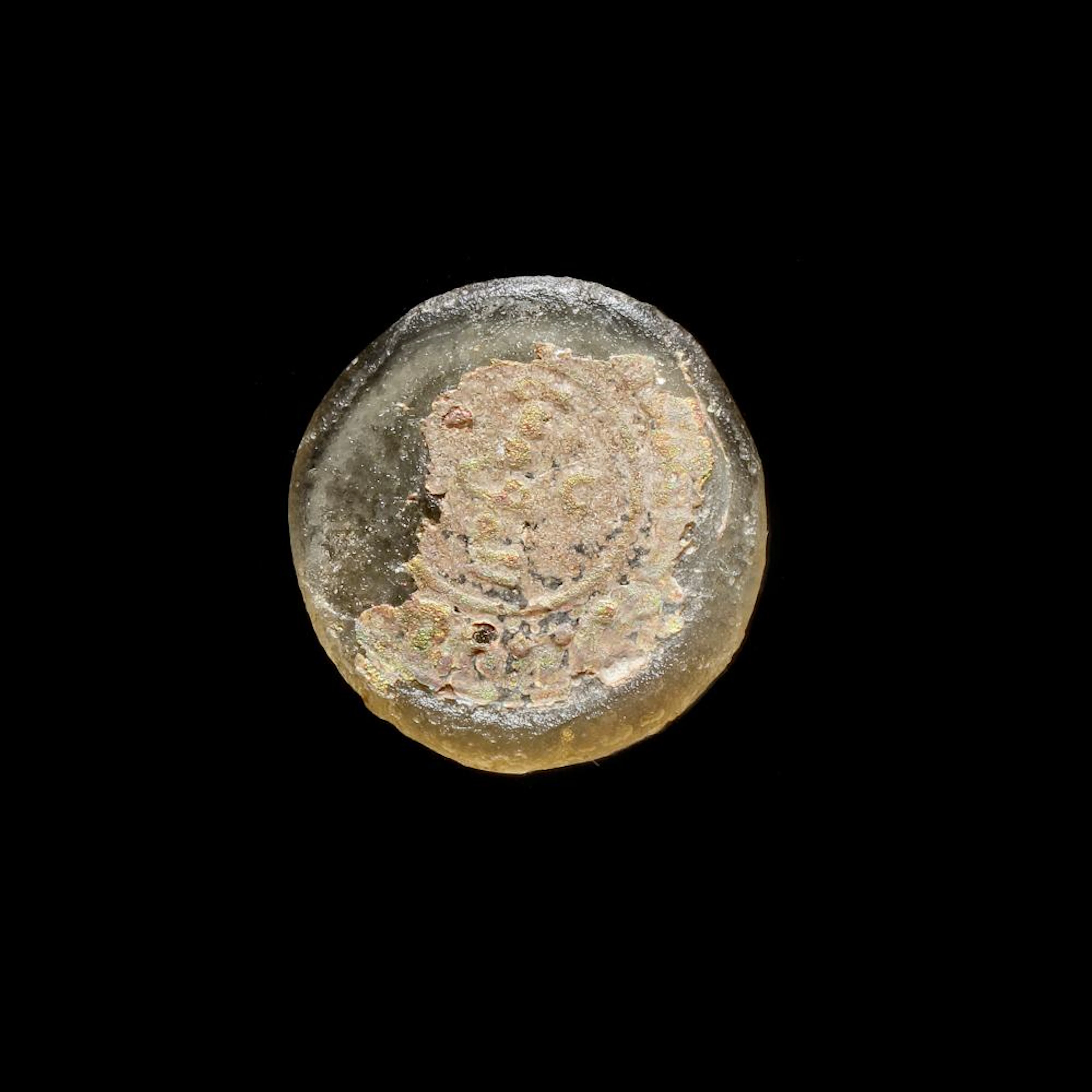A FATIMID GLASS WEIGHT THREE QUARTER DINAR