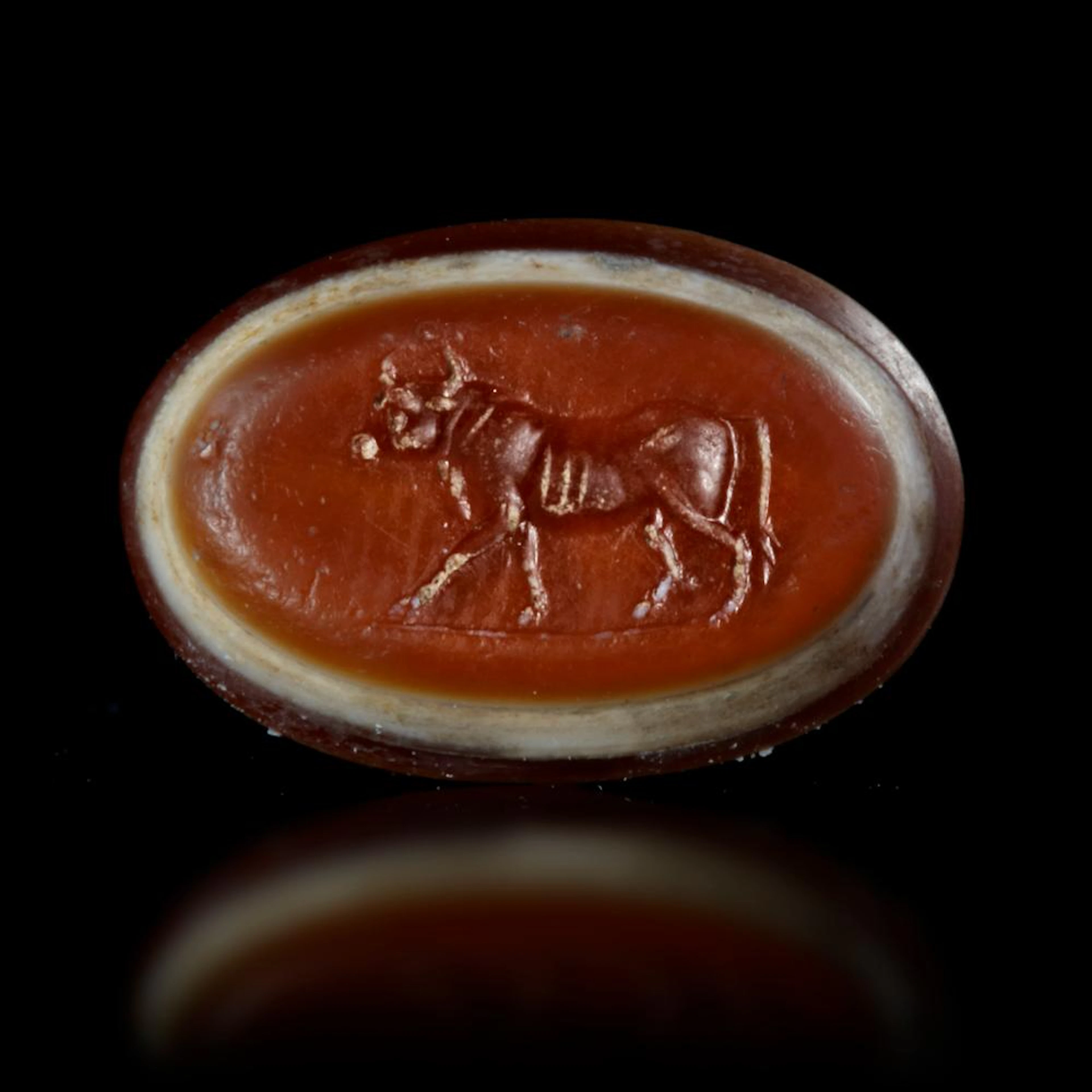 A ROMAN INTAGLIO WITH A WALKING BULL, 1ST CENTURY AD