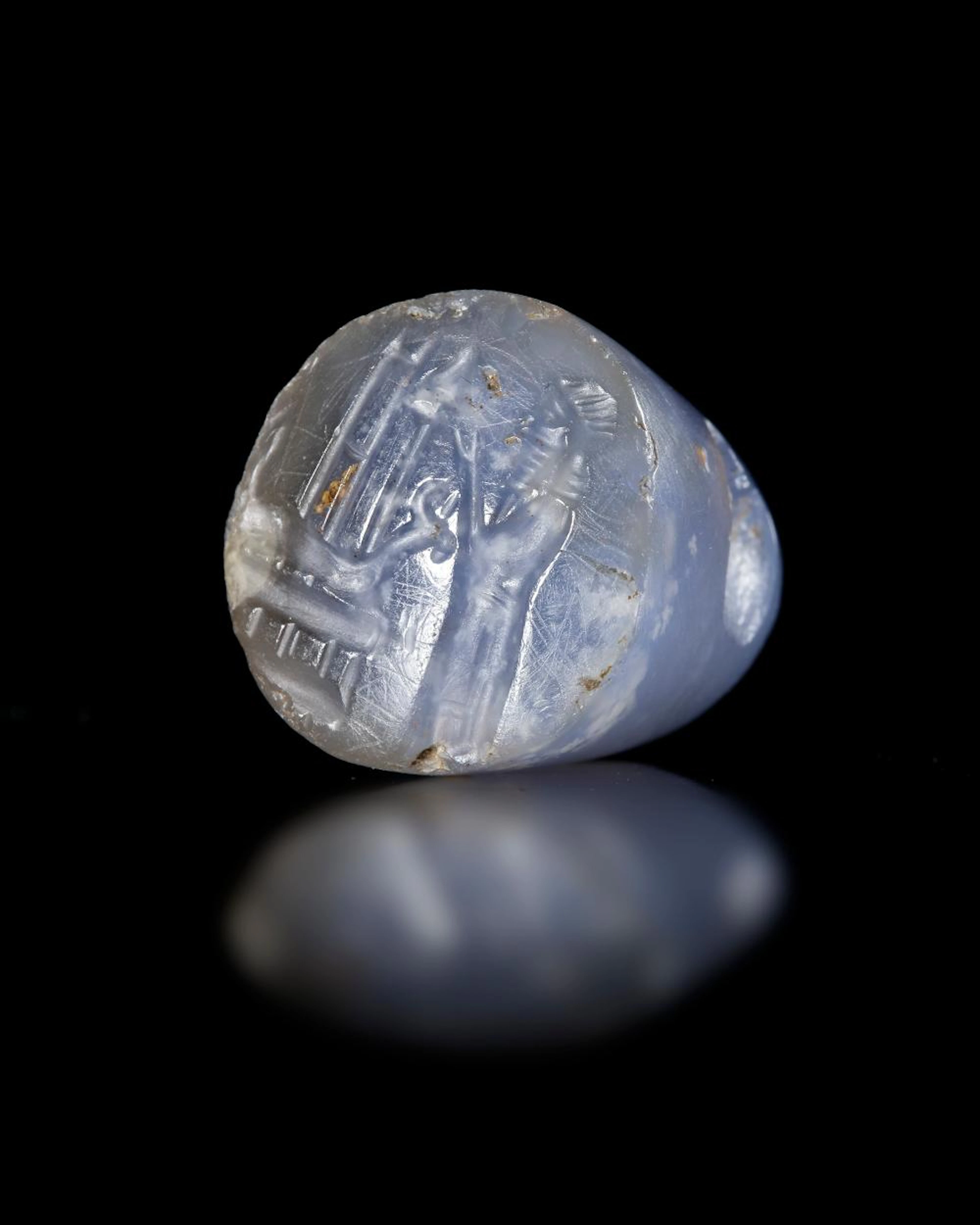 A BLUE CHALCEDONY NEO ASSYRIAN STAMP SEAL, 7TH-8TH CENTURY BC