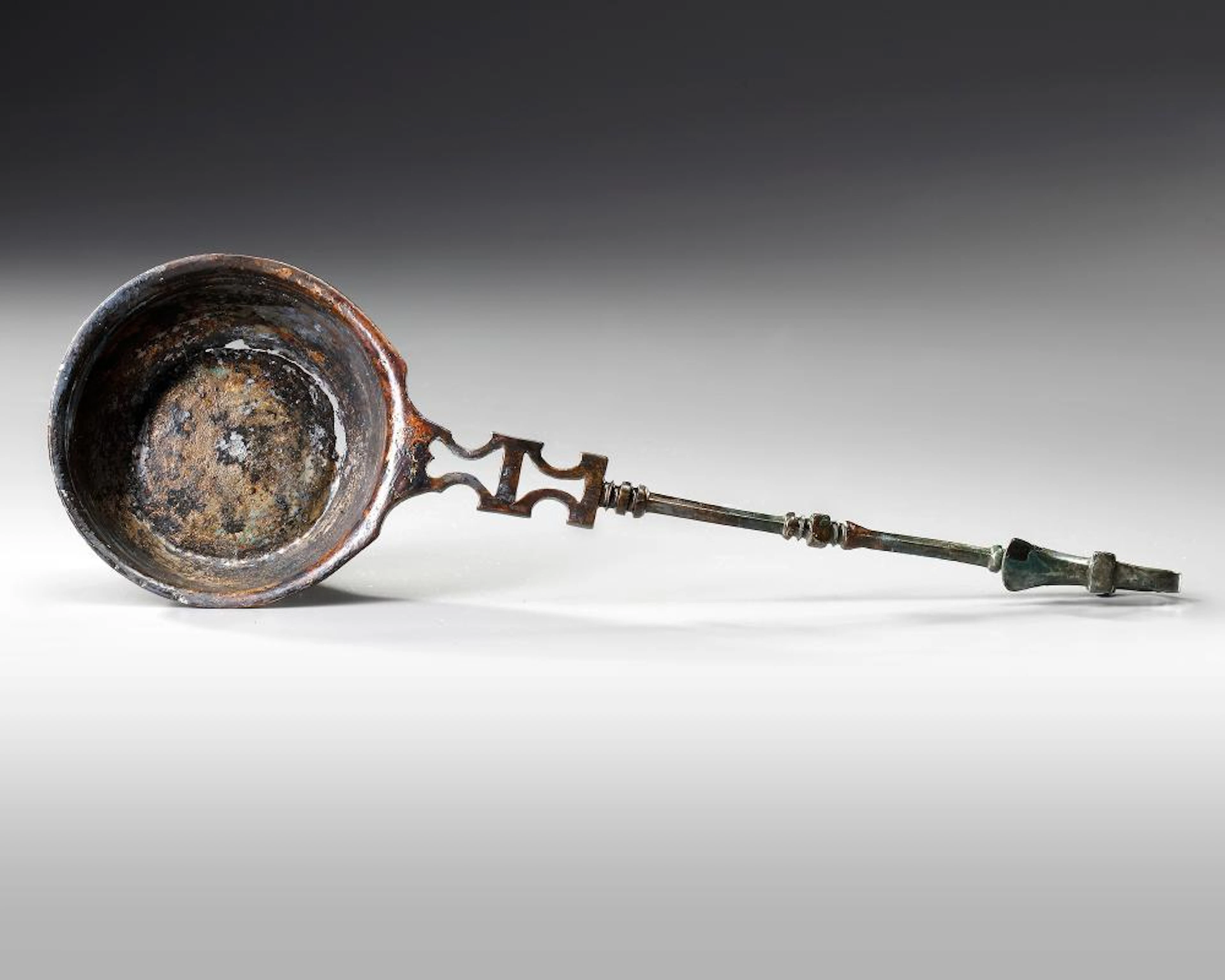 A ROMAN BRONZE LADLE, CIRCA 2ND-3RD CENTURY AD