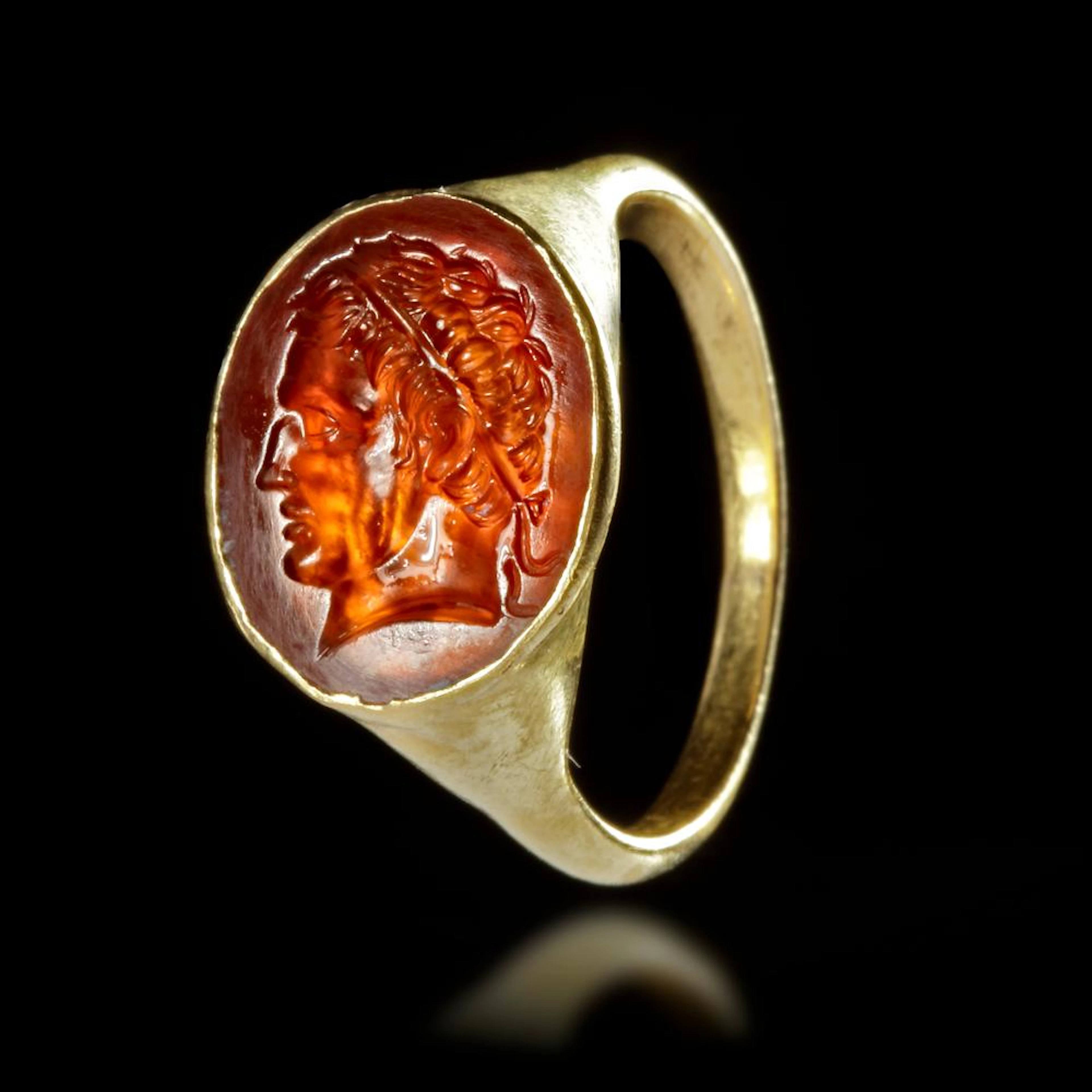 A GOLD RING WITH A CARNELIAN INTAGLIO WITH THE PORTRAIT OF A HELLENISTIC RULER