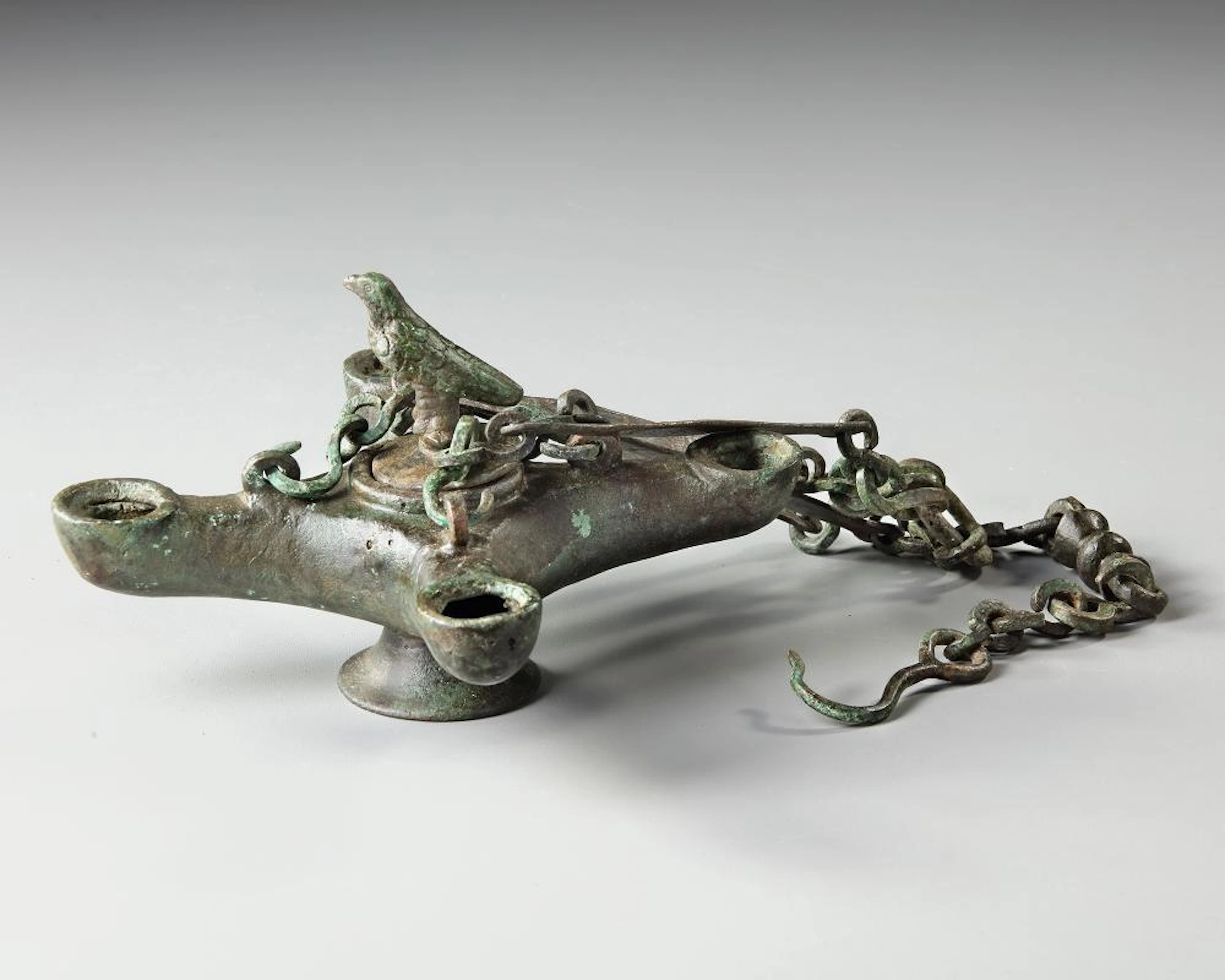 A BYZANTINE FOUR SPOUTED LAMP, 6TH-7TH CENTURY AD