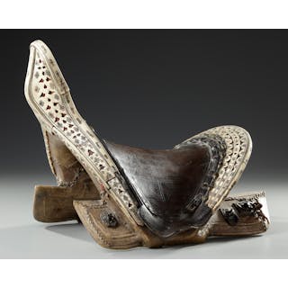A FINE LEATHER COVERED WOODED SADDLE, CENTRAL ASIA, 19TH CENTURY