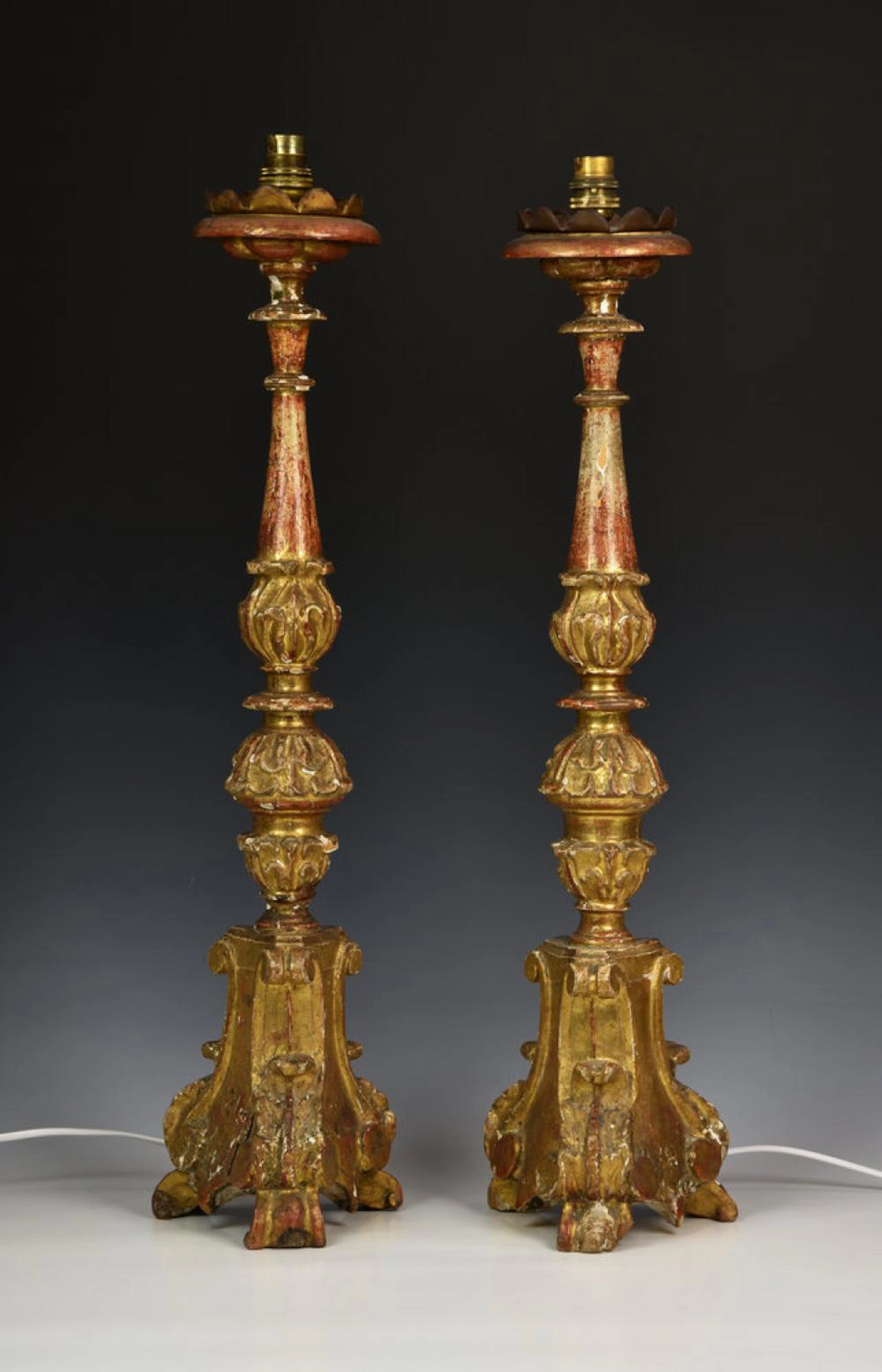 A pair of antique Italian carved giltwood and gesso...