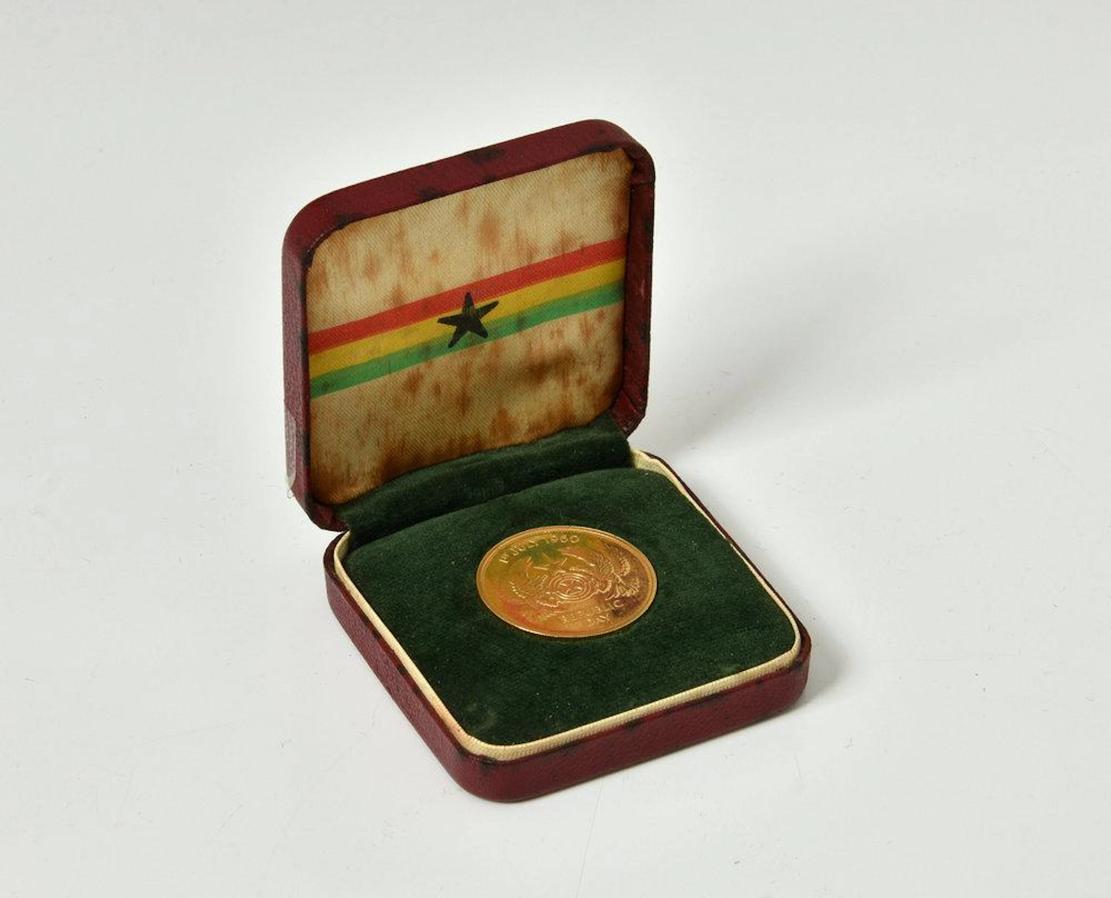 A cased Ghana 1960 Republic Day Two Pound Gold coin 16 grammes in box of issue
