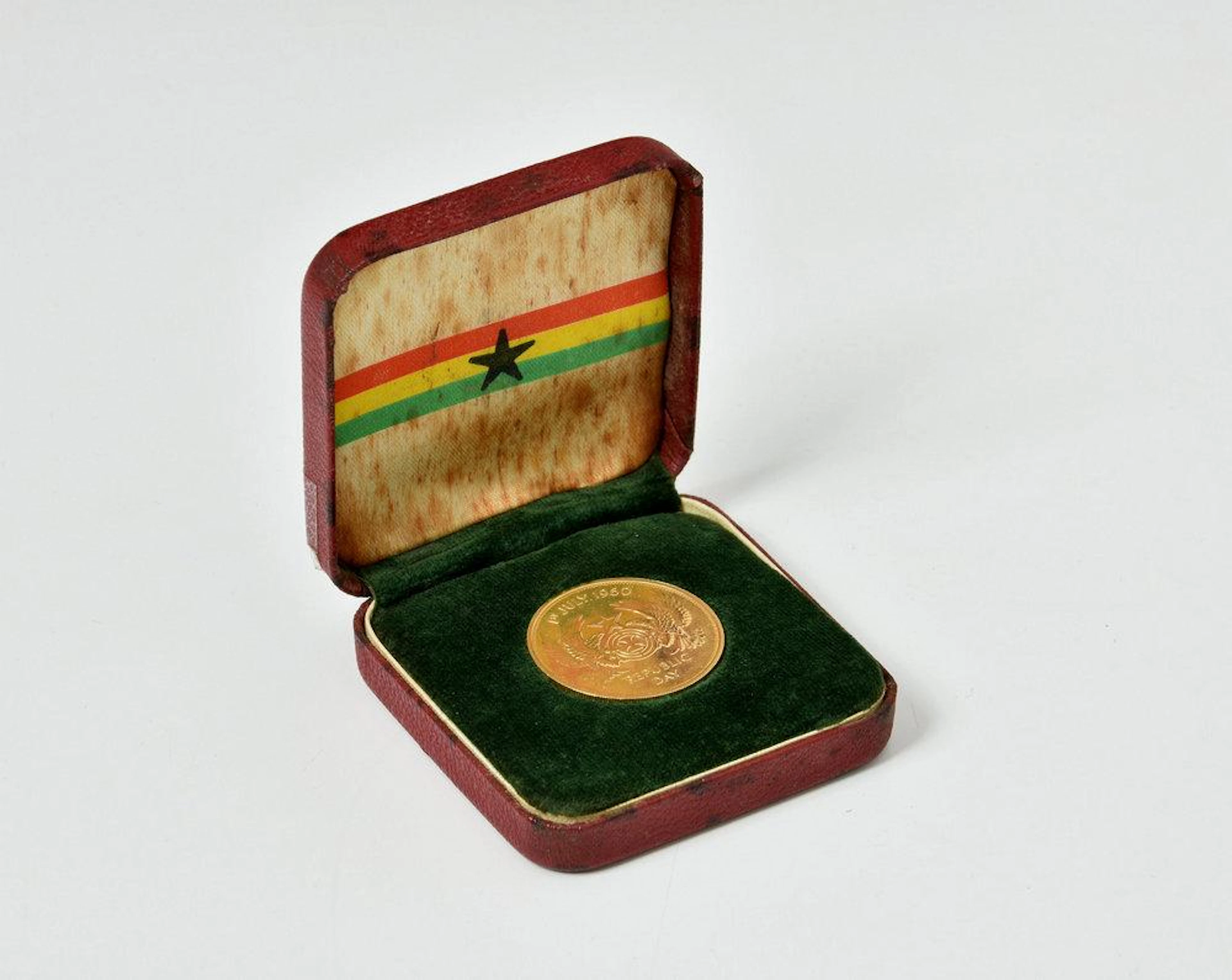 A cased Ghana 1960 Republic Day Two Pound Gold coin 16 grammes in box of issue