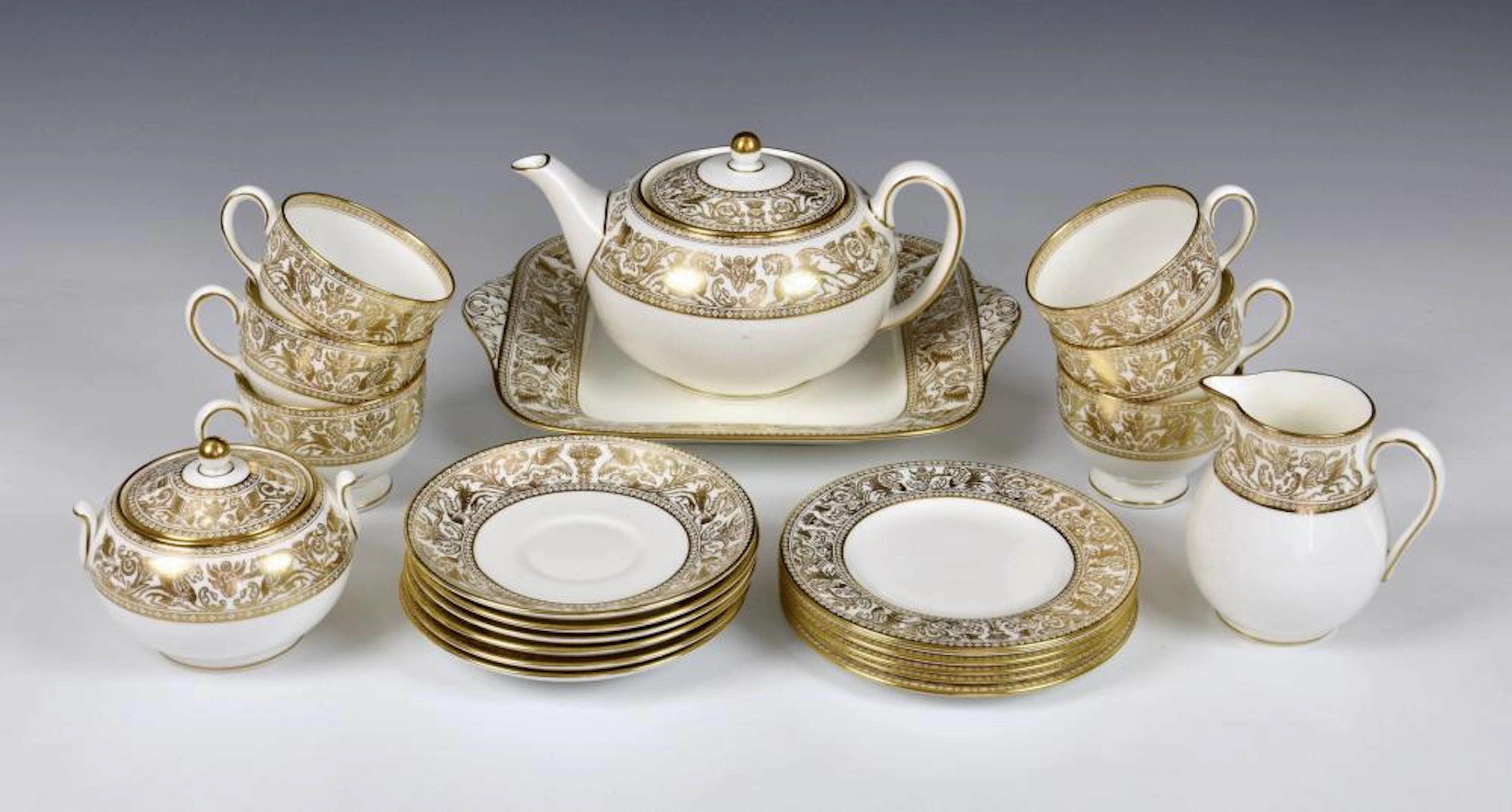 A Wedgwood China 'Gold Florentine' pattern tea service comprising of teapot