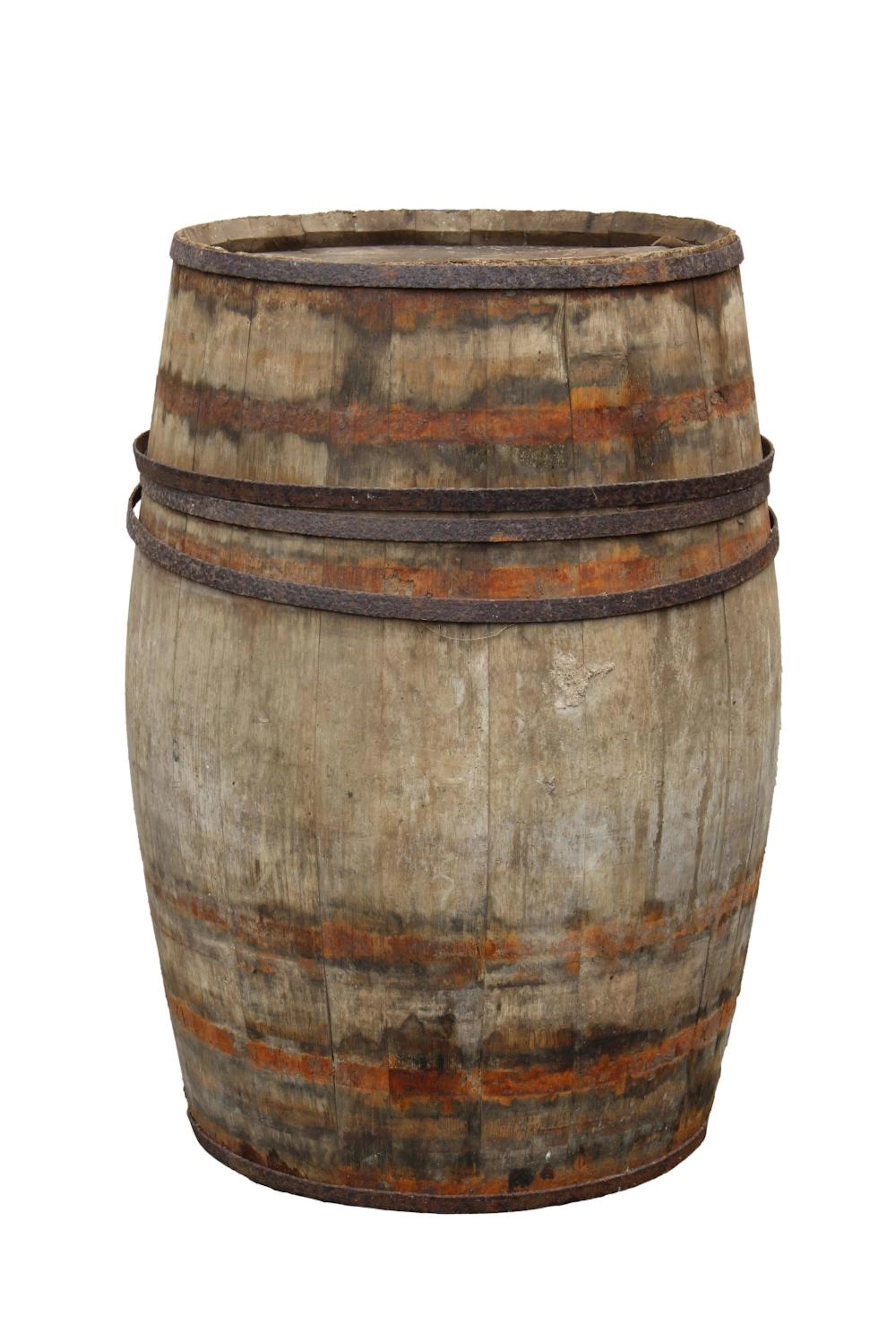 A large wooden barrel with metal banding for 'O & T Bacot, Cognac'