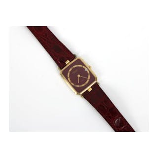 A Raymond Weil Geneve gold plated quartz watch with burgundy face