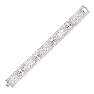 AN ART DECO DIAMOND AND RUBY BRACELET in platinum, comprising a row
