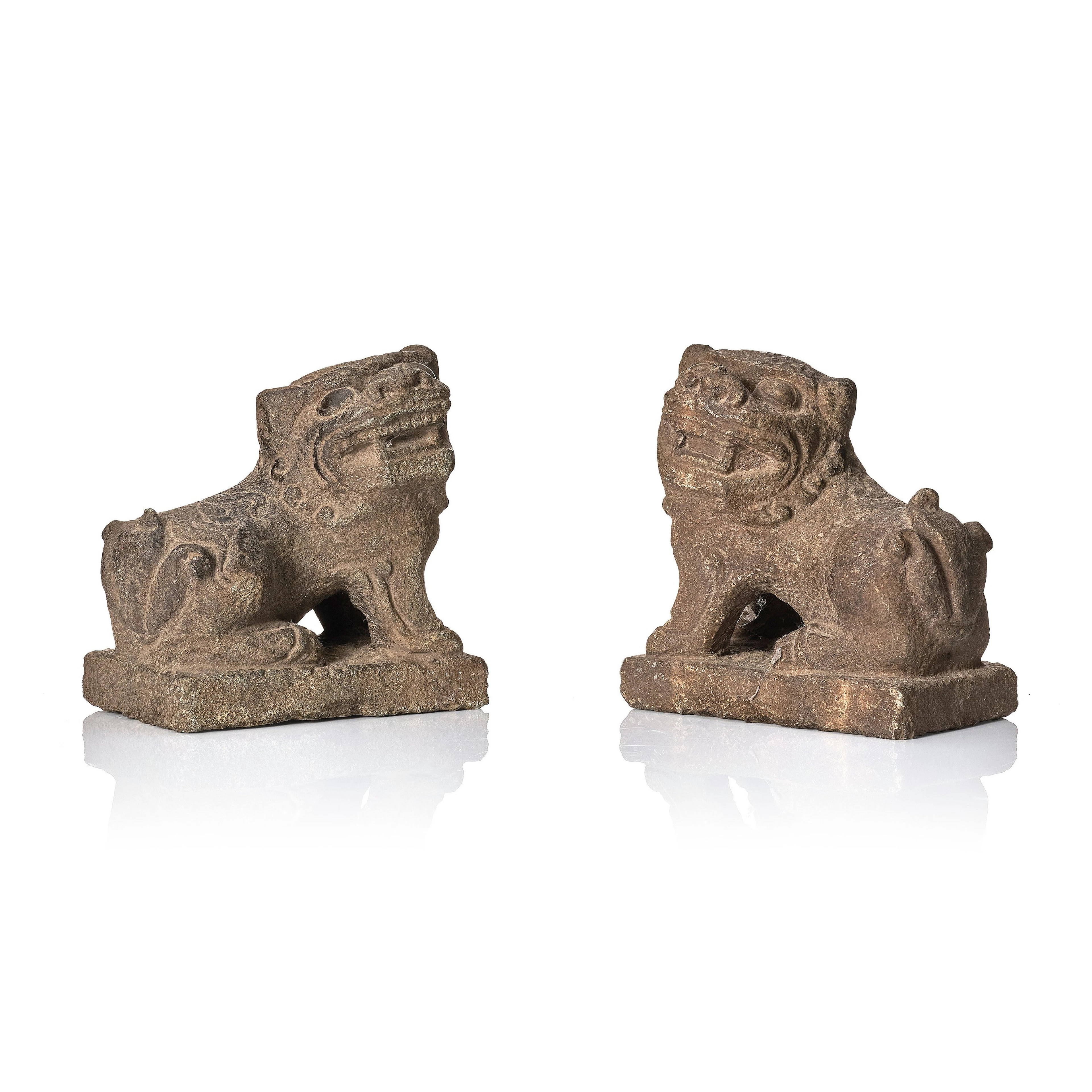 A pair of stone sculptures of buddhist lions, Qing dynasty (1664-1912).