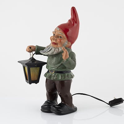 A West German earthenware gnome with lantern from the second half