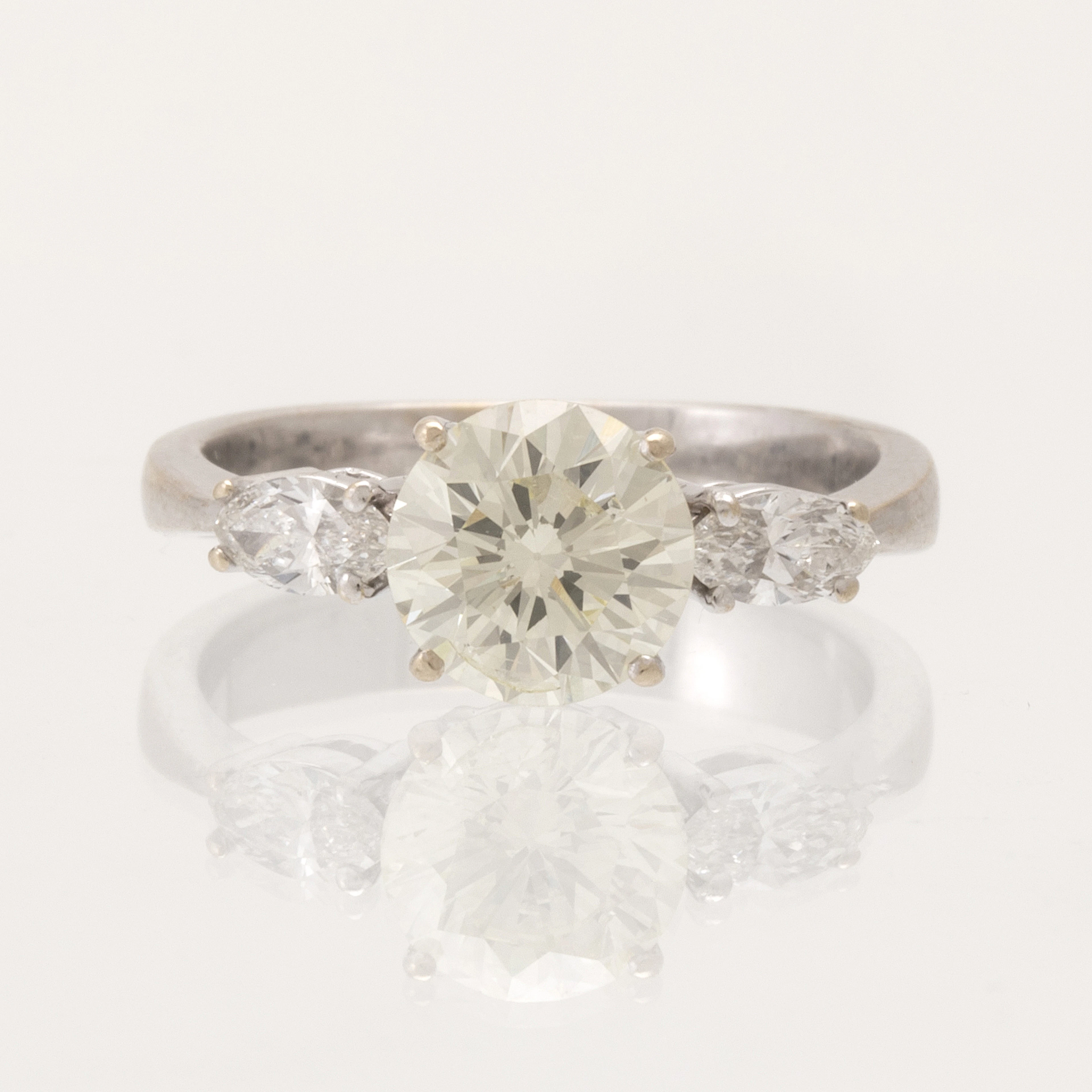 An 18K white gold ring set with one round brilliant-cut...