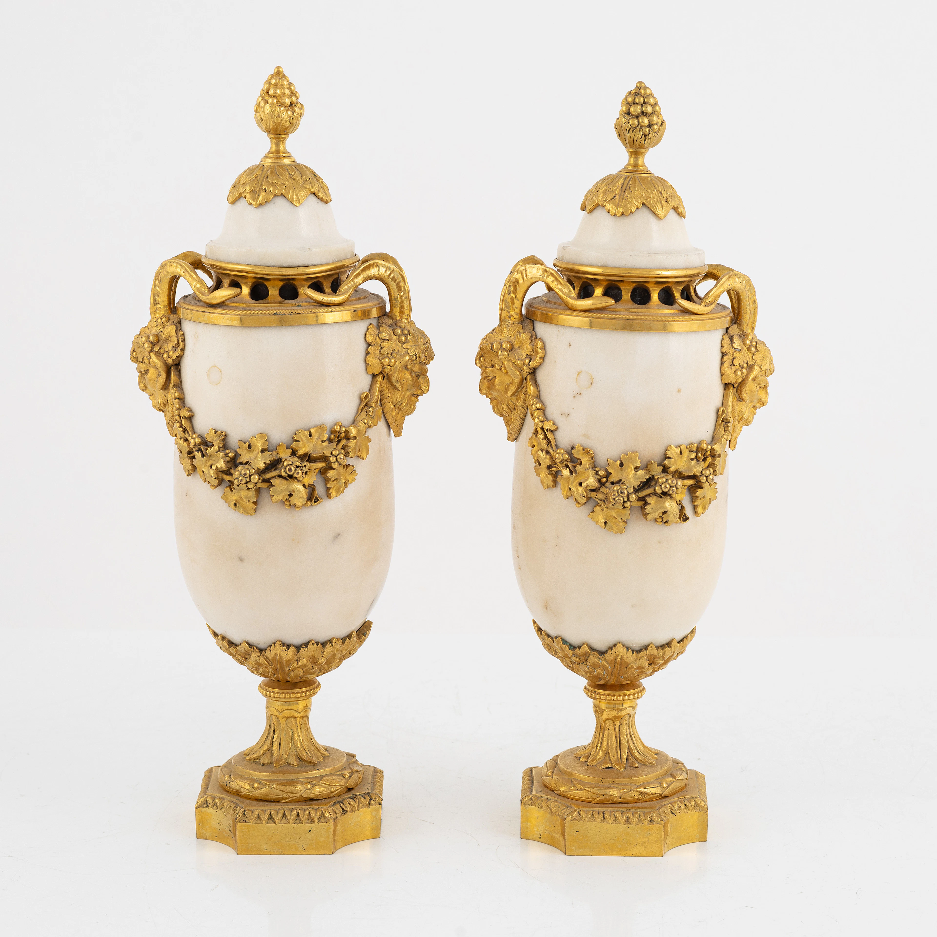 A pair of French Louis XVI-style Napoleon III gilt-bronze and marble urns
