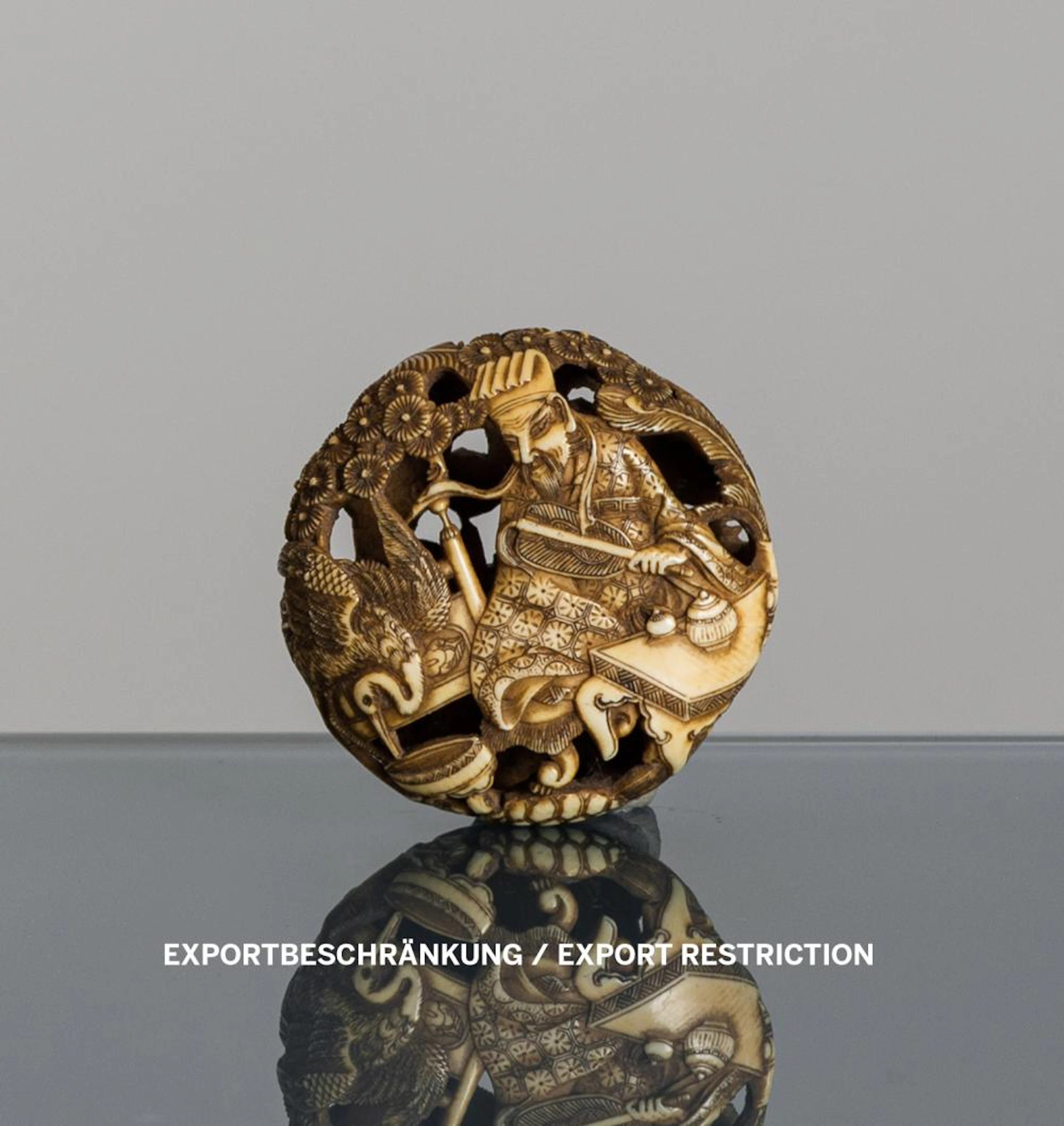 A FINELY CARVED IVORY RYUSA MANJU OF THE CHINESE POET RINNASEI