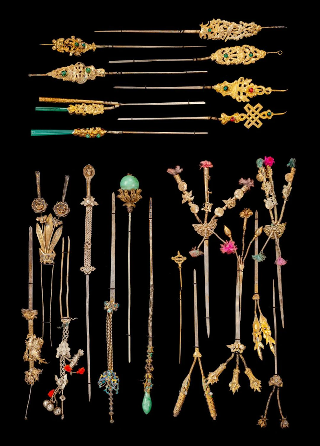 A GROUP OF 23 HAIRPINS WITH MOVABLE ORNAMENTS