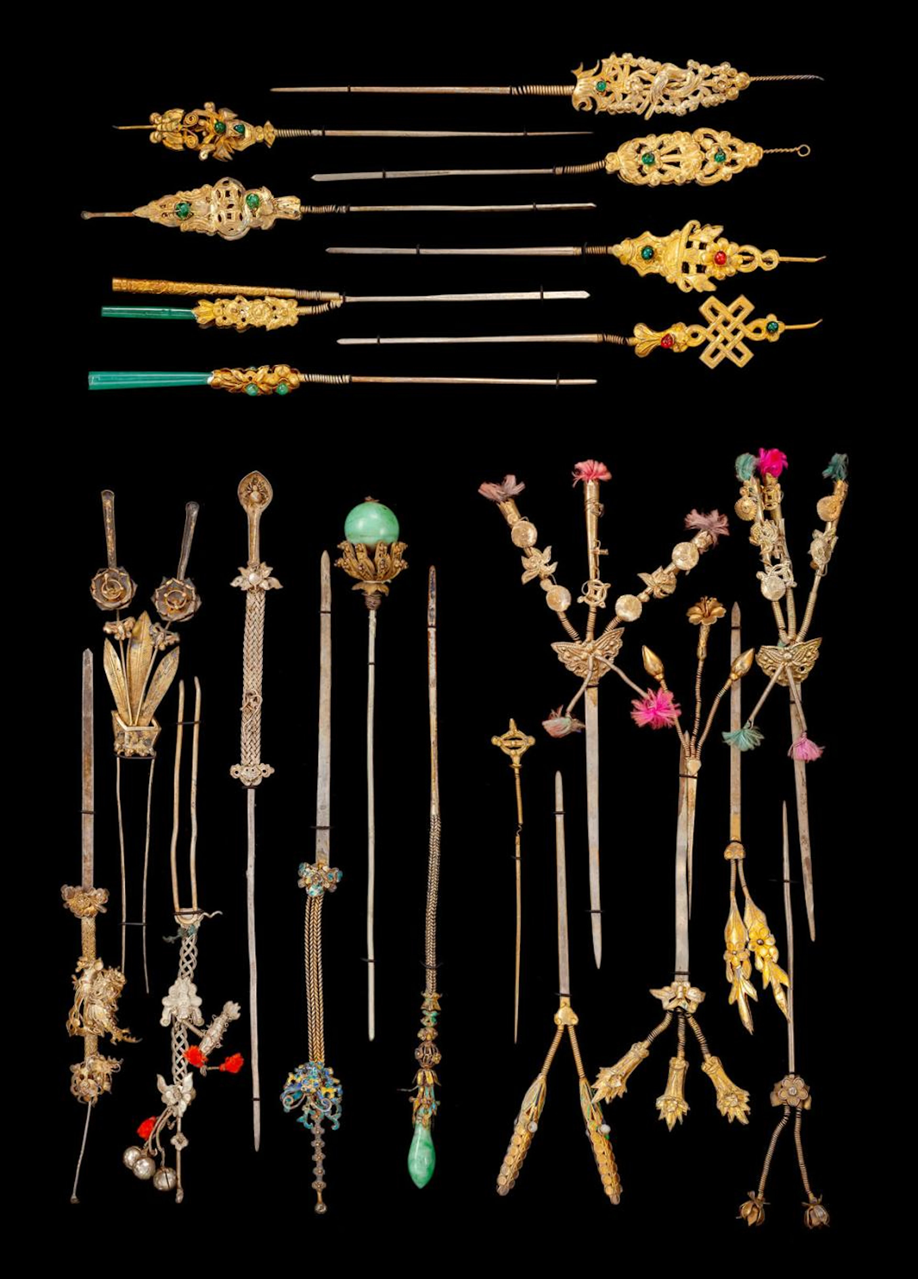 A GROUP OF 23 HAIRPINS WITH MOVABLE ORNAMENTS