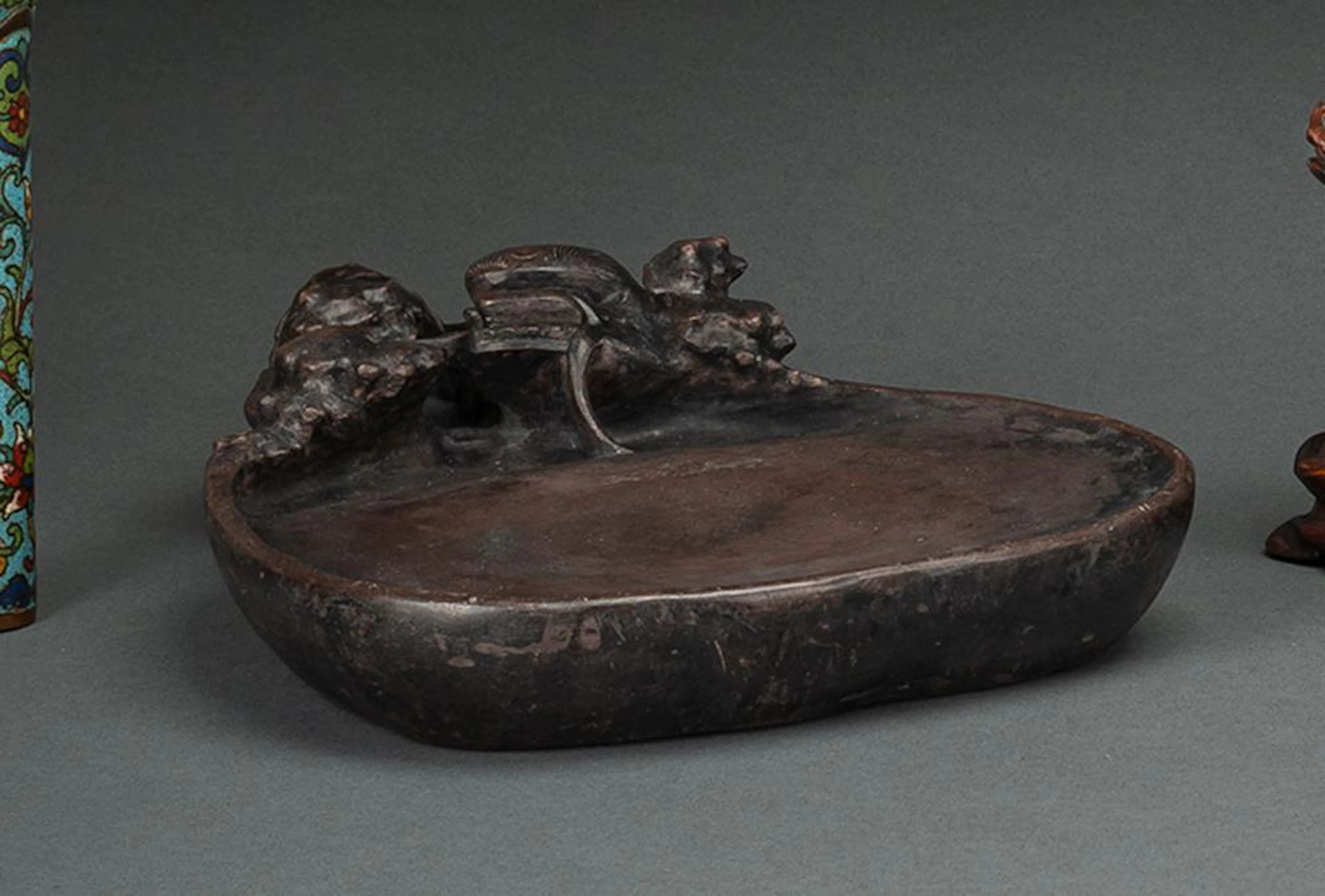 AN INK RUBBING STONE WITH DRAGON AMONG CLOUDS IN RELIEF