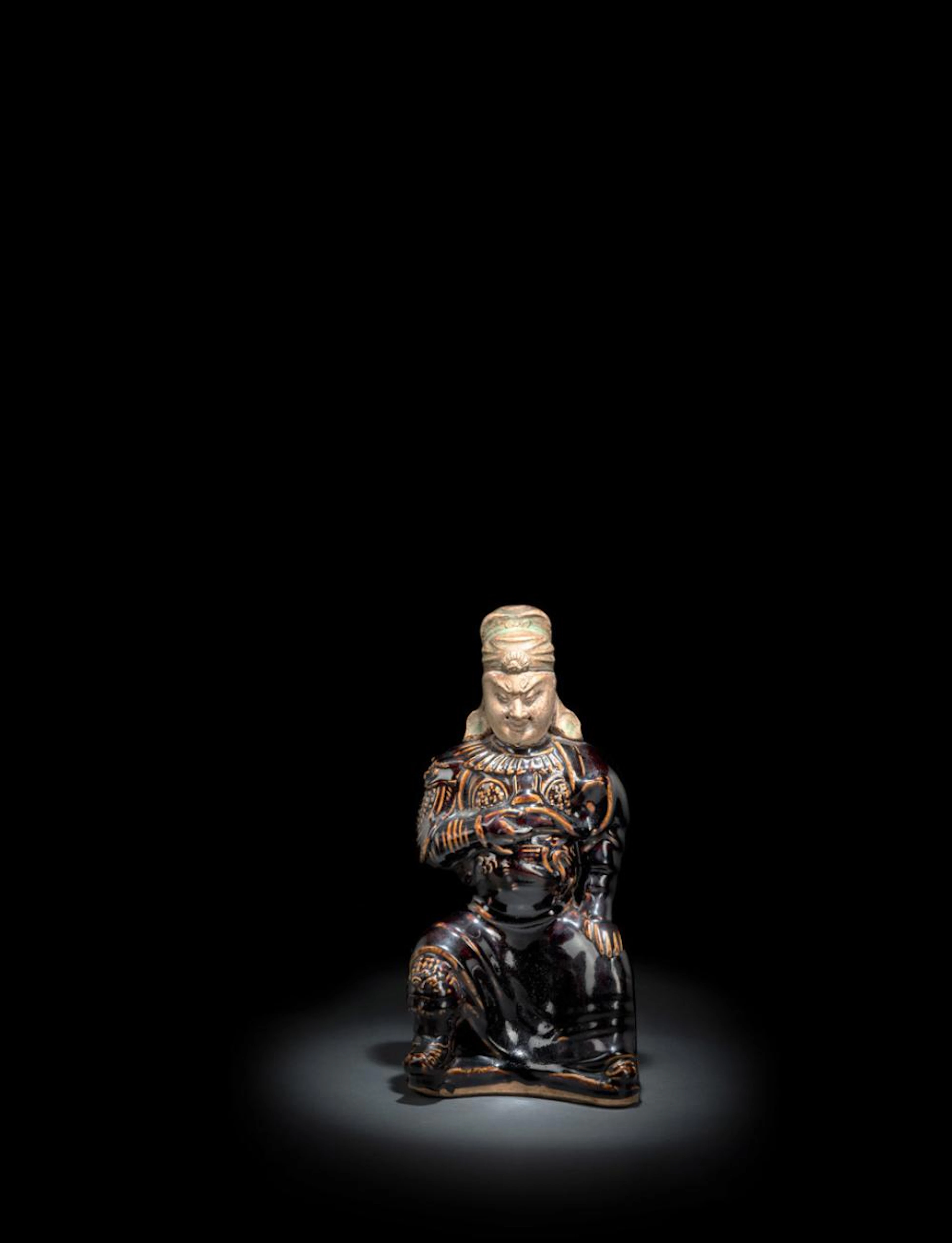 A RARE BROWN-GLAZED CIZHOU FIGURE OF SEATED GENERAL