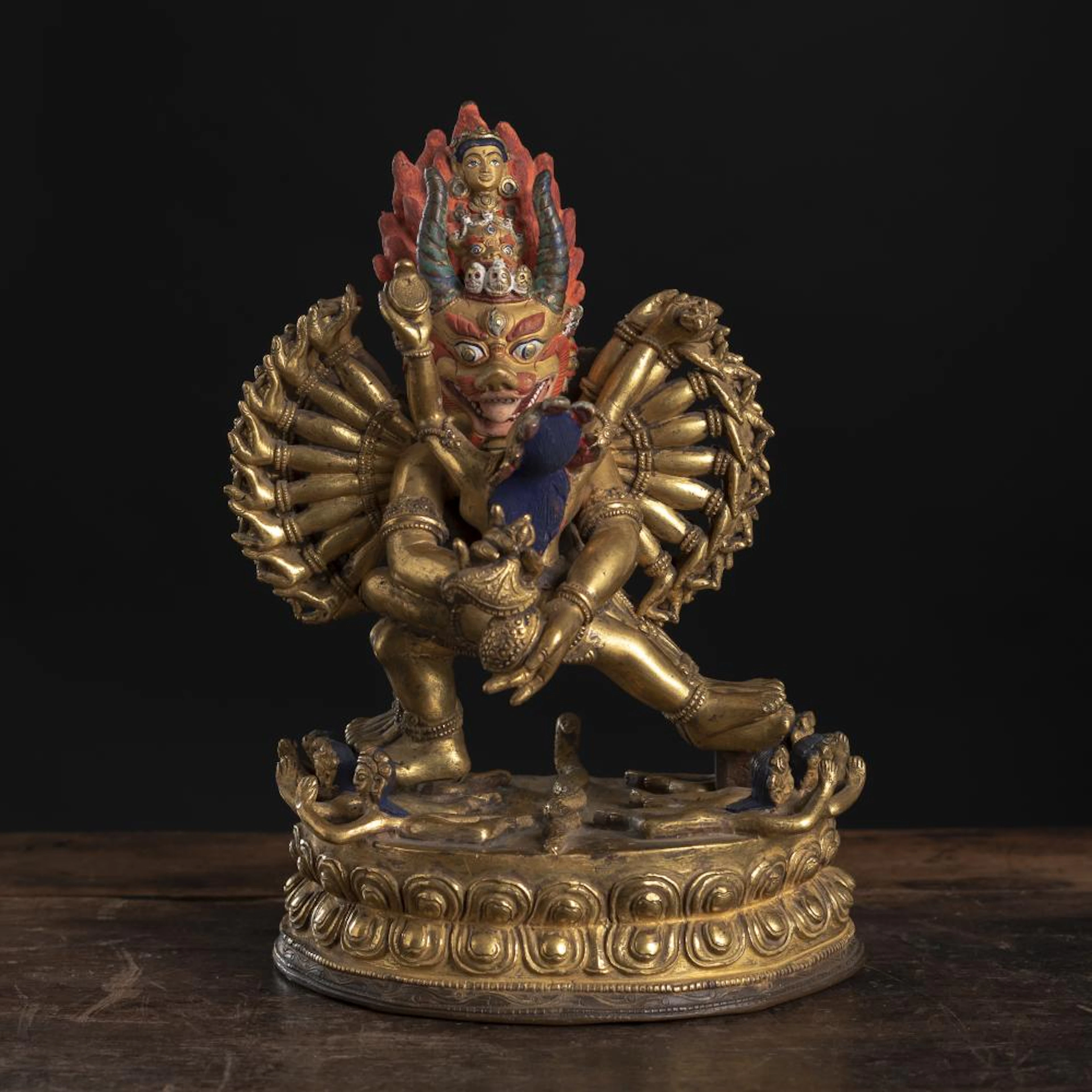 A PARCEL POLYCHROME GILT-BRONZE FIGURE OF VAJRABHAIRAVA