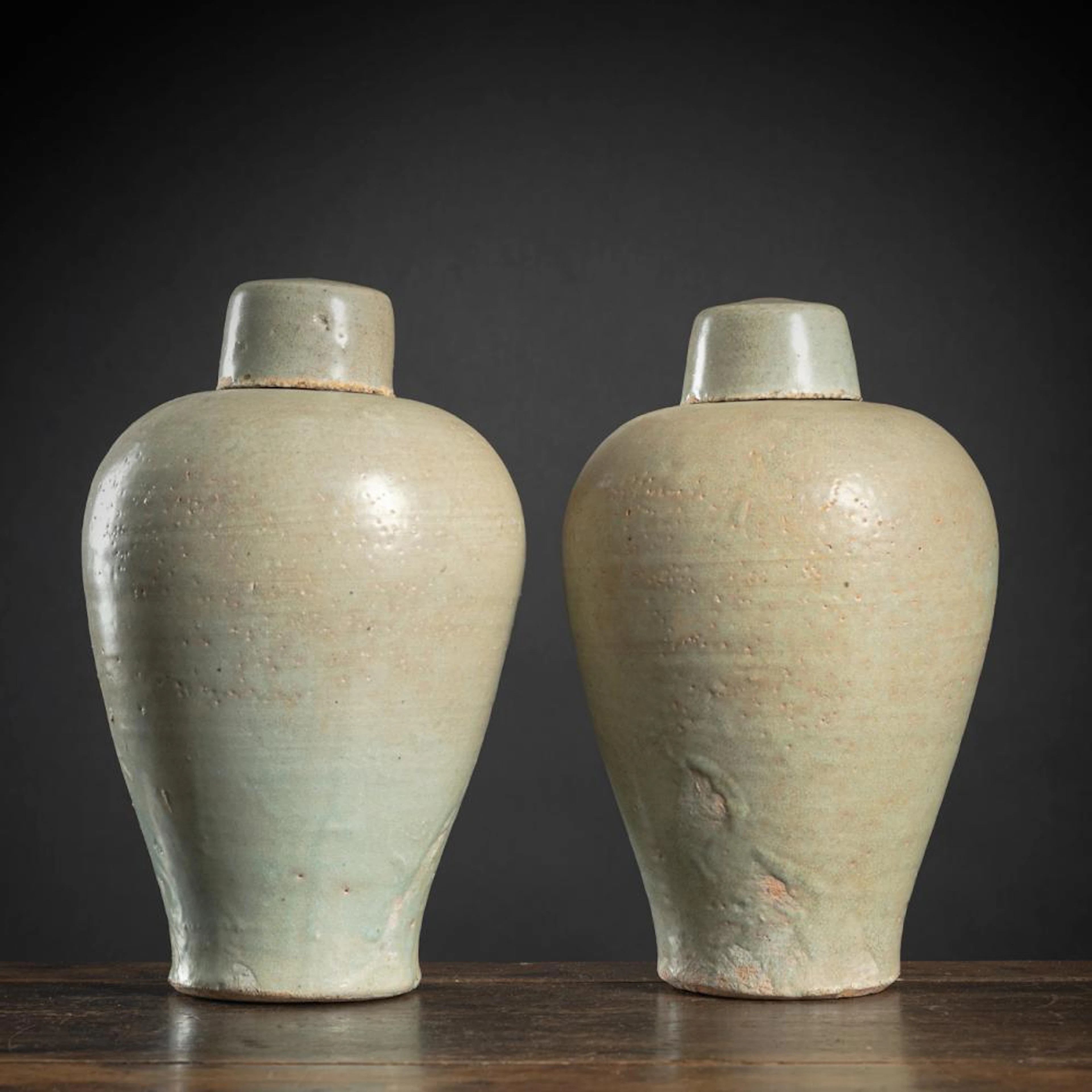 A PAIR OF GREY CERAMIC VASES AND COVERS 'MEIPING'