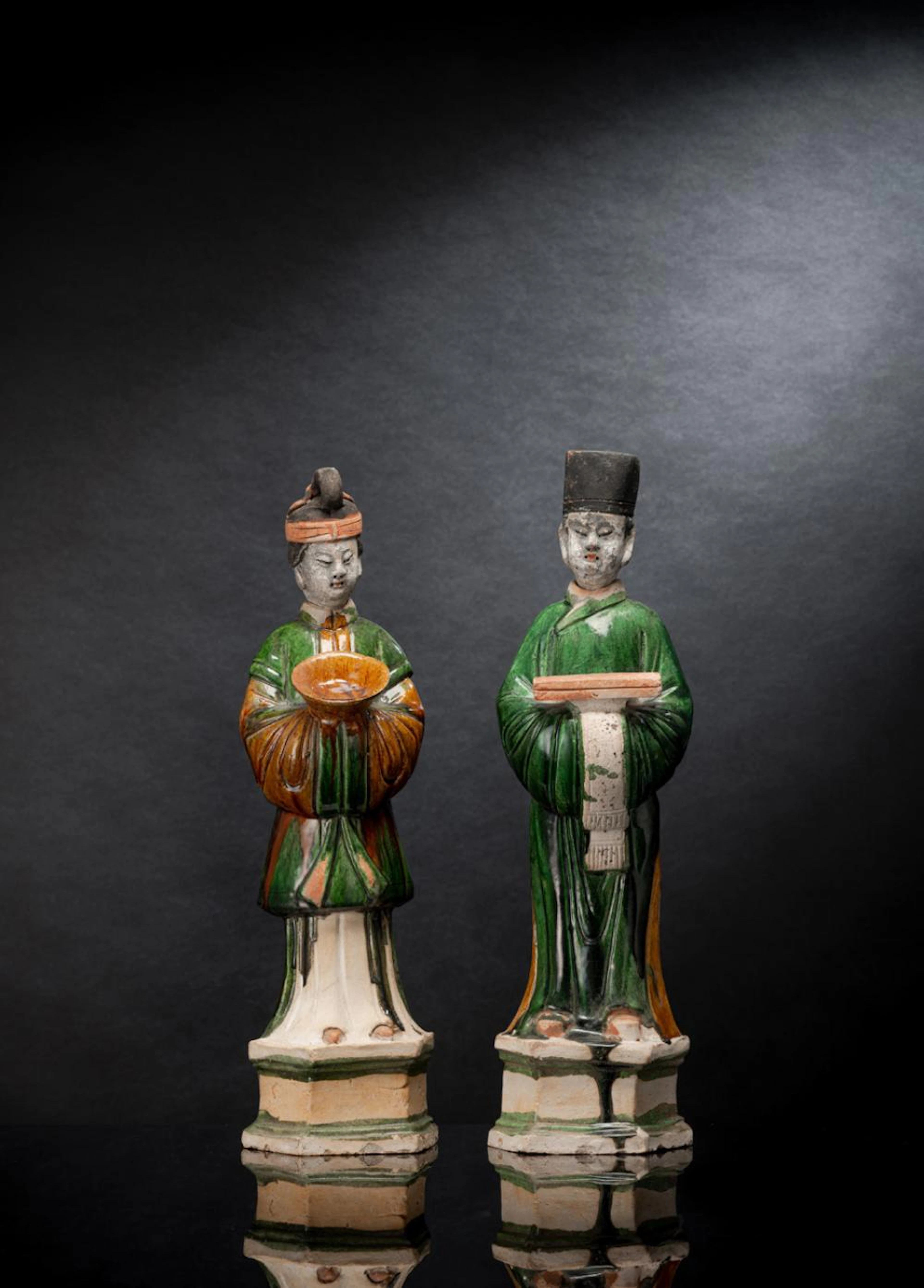 A LARGE PAIR OF SANCAI-GLAZED POTTERY COURT FIGURES OF A...