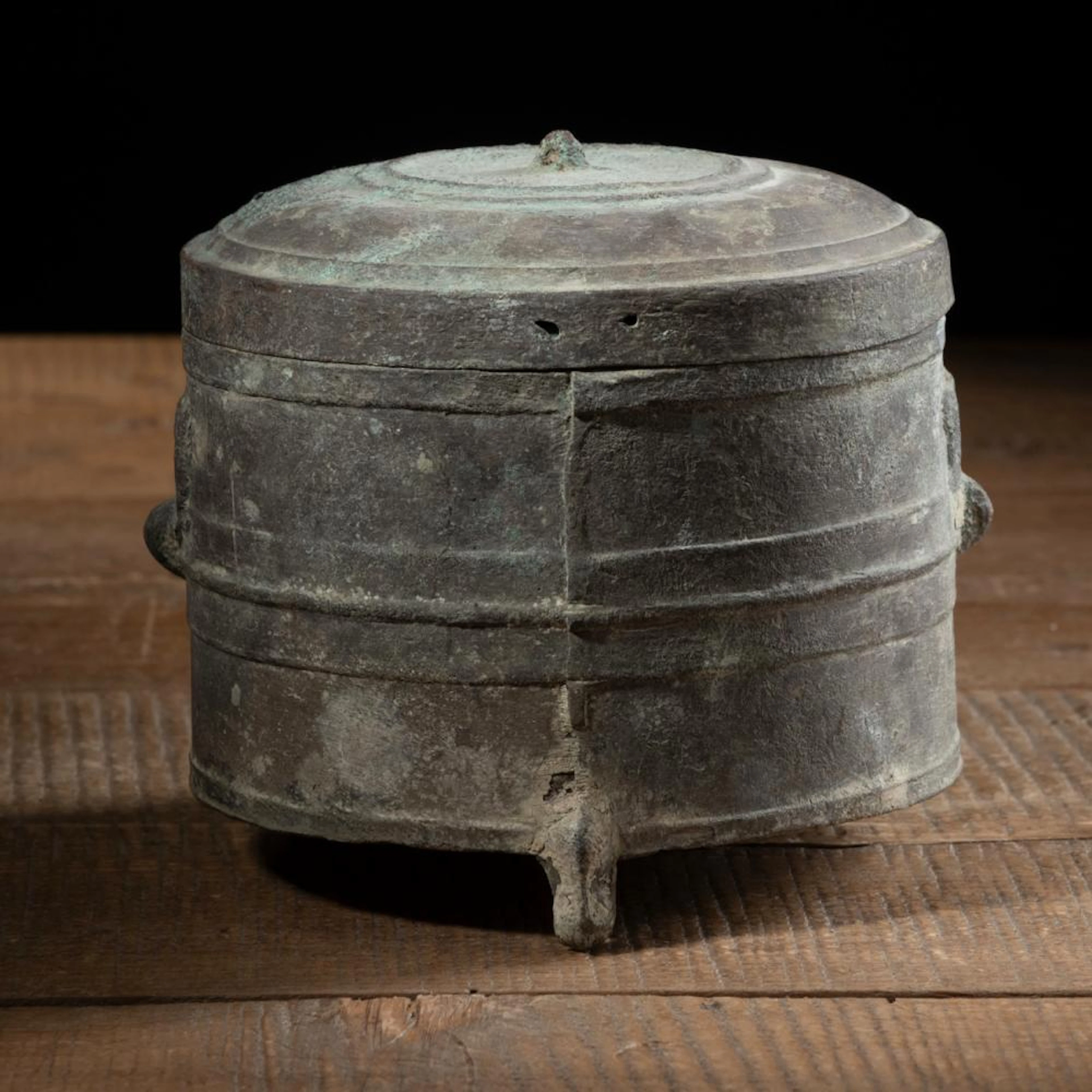 A CYLINDRICAL BRONZE LIAN WITH COVER WITH TWO TAOTIE MASKS IN LOW RELIEF
